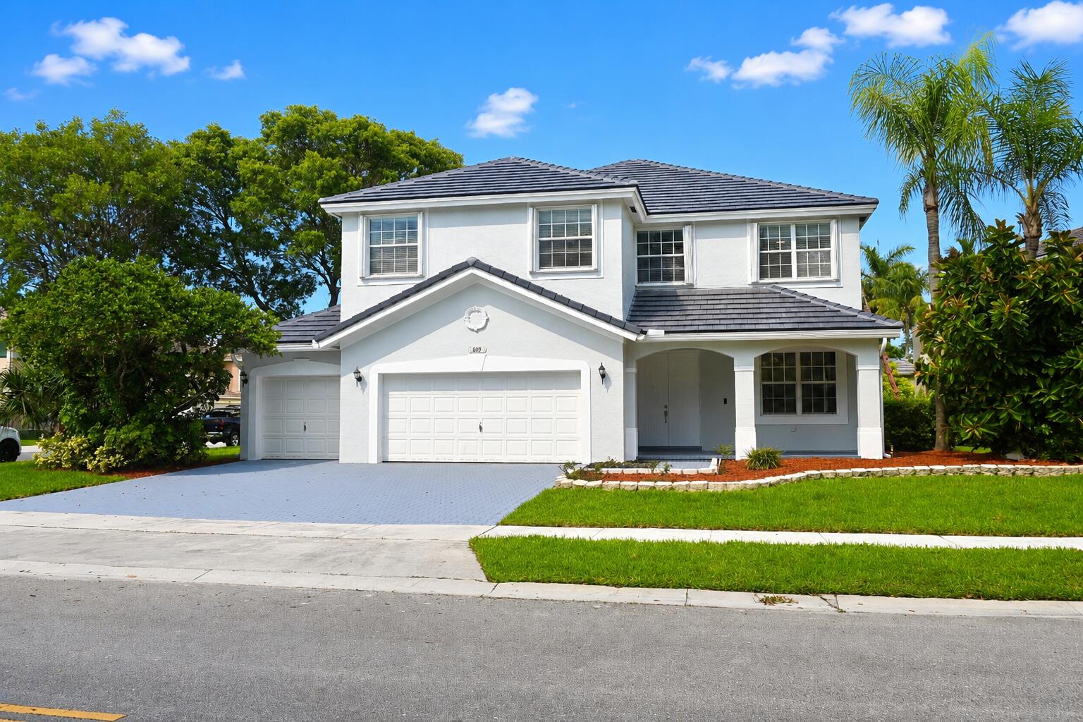 Your search is over! This highly maintained 5-bed, 2.5-bath, oversized corner lot luxury home, in the highly sought after Sandal Cove subdivision of the Pembroke Shores community, is an absolute must see! Spacious 2-story CBS residence boasting a Brand New Flat Concrete Roof (July 2026), a full exterior & interior paint refresh, new in-ceiling lighting and more. The inviting downstairs floor plan is finished in ceramic tile flooring and the chef's kitchen trimmed with tiled countertops & full backsplash, stainless steel appliances, real oak cabinetry, breakfast island for daily use & entertaining, and a smartly appointed half-bathroom. The wood split entry staircase leads you to the 2nd floor that is adorned in wood laminate flooring. The Primary Suite offers a generous and well proportioned space, detailed with solid oak floors, a tray ceiling, large walk-in closet, and an extra room that can serve as a bedroom, nursery, office, or more. Generously sized on-suite bath, showcasing a walk-in shower, soak-in corner tub & dual vanities. Newer high efficiency 2nd floor A/C unit, All 5 bedrooms & 2 full bathrooms, are strategically located on the 2nd floor providing privacy from downstairs daily living & entertaining. The oversized corner lot with a majestic mature Oak tree provide undeniable curb appeal and a serene space for you and your family to enjoy. The backyard concrete patio area is large and the yard itself provides plenty of room for a future custom pool! Custom fitted metal storm shutter panels are at the ready for window & door protection. are stored within the enormous 3-car garage space that has a custom epoxy floor finish, a new garage door opener, insulated garage doors and abundant storage shelving space. for the DYI'er or car enthusiast's work space. This community is within walking distance to K-12 level Pembroke Pines Community schools, plus local shopping and dining options: Don't miss your chance on this must see home!