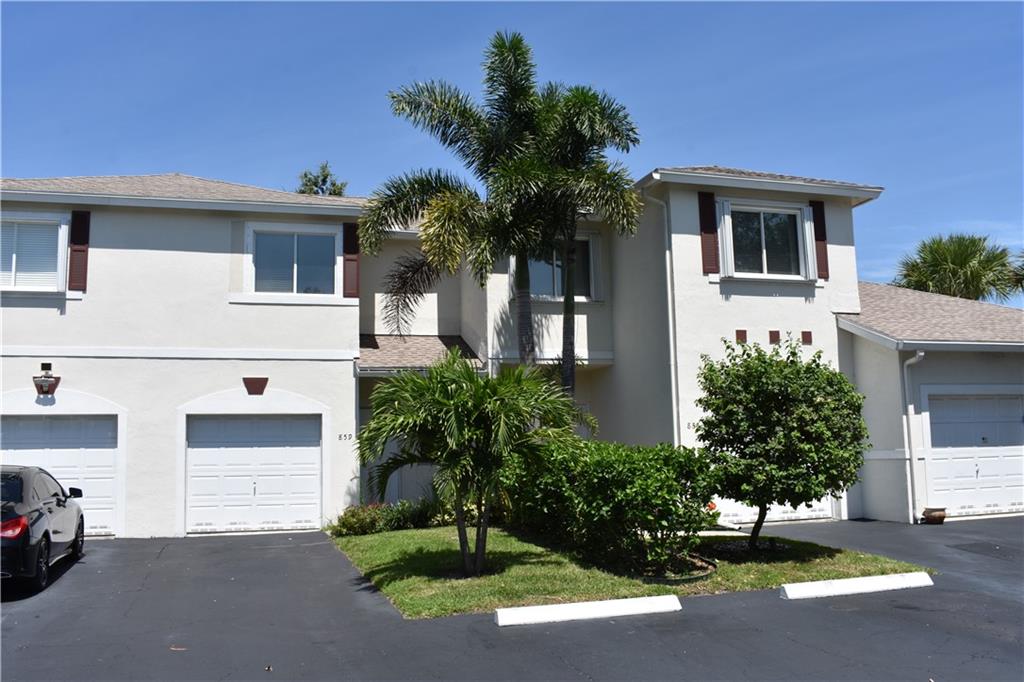 Stunning 2 bedroom 2.5 bath townhome offers flat ceilings & crown moldings throughout, new reverse osmosis water system, new ceiling fans, new hot water heater, newly fenced private back patio, washer & dryer inside, 1 car attached garage, and more!  Interior 1st level features cherry wood floors throughout, upgraded kitchen with expresso wood cabinets, stainless steel appliances, granite counters, and updated powder room w/free standing vanity & new fixtures.  Upstairs offers 2 master suites both w/updated bathrooms incl. gorgeous porcelain tiled shower walls & mosaic glass, frameless glass shower doors, new vanities with stone tops, & real wood closet organizers.  Well located close to shopping and I95. Amenities include private pool, plenty of guest parking, low HOA dues & pet friendly!
