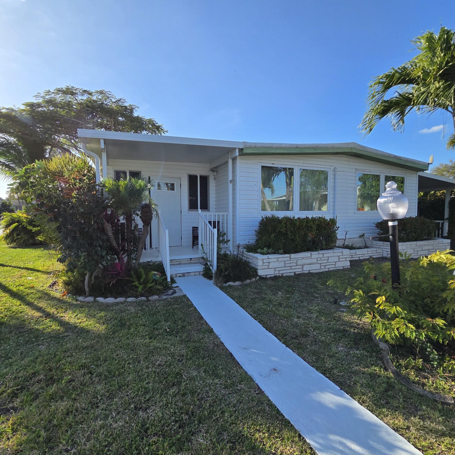 BEAUTIFUL AND SPACIOUS HOME, COMPLETELY RENOVATED WITH 2 BEDROOMS, 3 BATHS AND AN ENCLOSED FLORIDA ROOM WITH A SEPARATE ENTRANCE, THAT COULD BE A 3RD BEDROOM. HOME IS LOCATED IN DEERFIELD LAKE, A BEAUTIFUL 55+ COMMUNITY, ONLY A FEW MILES TO THE DESIRABLE BEACH OF DEERFIELD.  PERFECT FOR RETIREES.   LOT RENTAL $1,062.71 MONTHLY. IT CAN BE FINANCE.