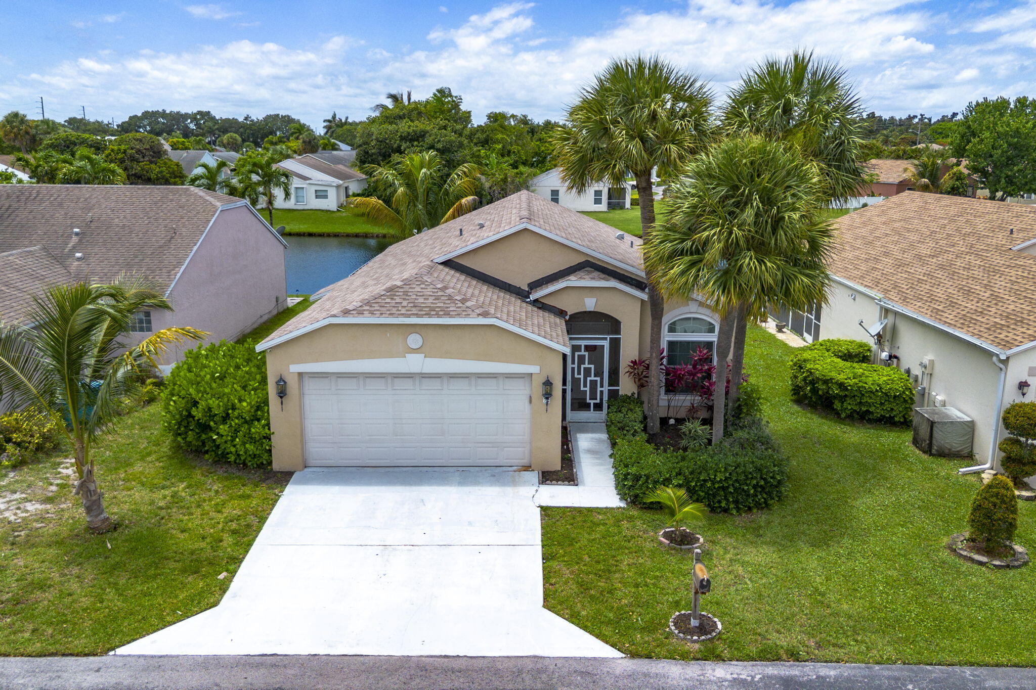 Rare opportunity to own this beautifully maintained 3-bedroom, 2-bath waterfront home with stunning lake views and desirable features throughout. Featuring impact windows for added peace of mind, plus an accordion shutter protecting the back patio door. This home also includes a gas generator a huge bonus for Florida living and storm season preparedness.  Enjoy relaxing mornings overlooking the water and the perfect indoor-outdoor lifestyle this property offers. Whether you're entertaining guests or simply unwinding by the lake, this home combines comfort, security, and value in one desirable package.