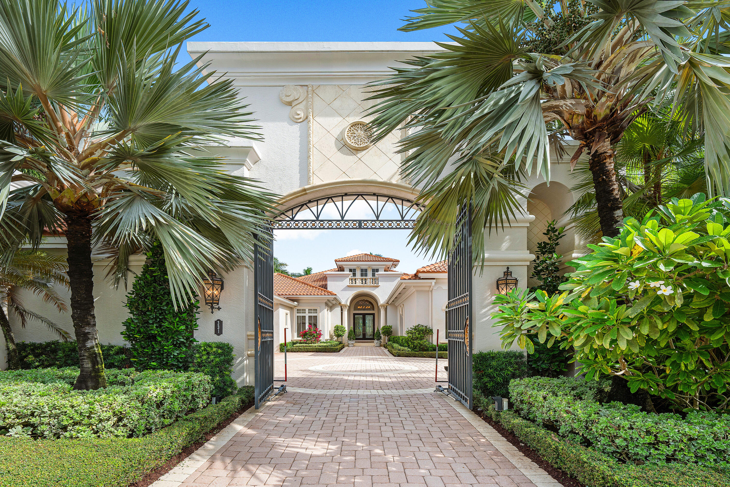 331 Mizner Lake Estates Drive is an exceptional property situated on the grounds of the iconic resort and club The Boca Raton. Separately located in the most prestigious 
double-security gated enclave of Mizner Lake Estates, this single-story residence 
features five bedrooms with expansive golf course and lake views, swimming pool, 
guest house, and four car garage/gated home entrance. The ultimate of privacy, 
security, luxury and proximity to world class country club living. The most coveted 
location in Boca Raton. The expansive layout includes a single story floorplan with high ceilings, four on-suites, gym, office and attached guest house. The primary suite wing overlooks the expansive backyard view and offers an opulent master bathroom with separate vanities, showers, soaking tub, water closets and large walk-in closets. The warm hardwood paneled retreat/office is perfectly situated away from the main living spaces. Outdoor kitchen, dining, entertaining spaces. No membership is required but is offered through The Boca Raton. Simplicity of living with the association maintaining the pool, landscaping, and water. Truly the finest resort style living with unique privacy and security.
