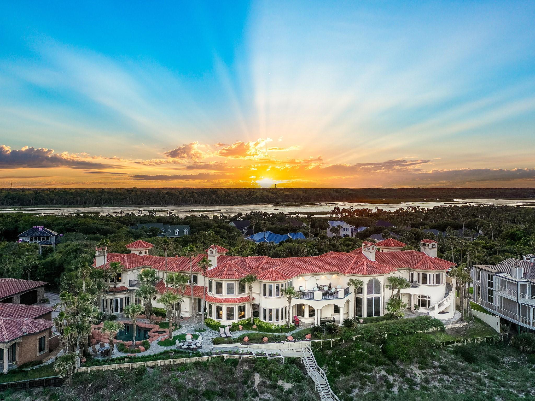 SOLD at Luxury AUCTION Without Reserve on Feb 23, 2024! List price for REFERENCE ONLY. Exceptionally private and protected, thanks to a gated entry and 30-ft build elevation, the property occupies 1.5 acres with 200 ft of ocean frontage. Its custom-built, Mediterranean-style residence spans 12,700 sf, with 6 beds, 7 full and 3 half-baths. Notable amenities include 2 gourmet kitchens, an executive office, media room, fitness center, wine cellar, elevator, and 6-car garage. Outdoor living areas feature a resort-style “lagoon” pool & spa, firepit lounge, and private boardwalk to the beach. Just minutes to the Ponte Vedra Inn & Club and the TPC Sawgrass golf course, home of The Players Championship and PGA headquarters. Do NOT call Listing Agent directly. For info, call Office Phone or 800 Number in listing... Buyer Brokers protected. Selling Without Reserve at Luxury AUCTION Feb 23, 2024! Refer to Luxury Auction Terms of Sale (avail. upon request). Current list price for REFERENCE ONLY. Convenient, Pre-Auction Previews held daily by appt. through Feb 22.