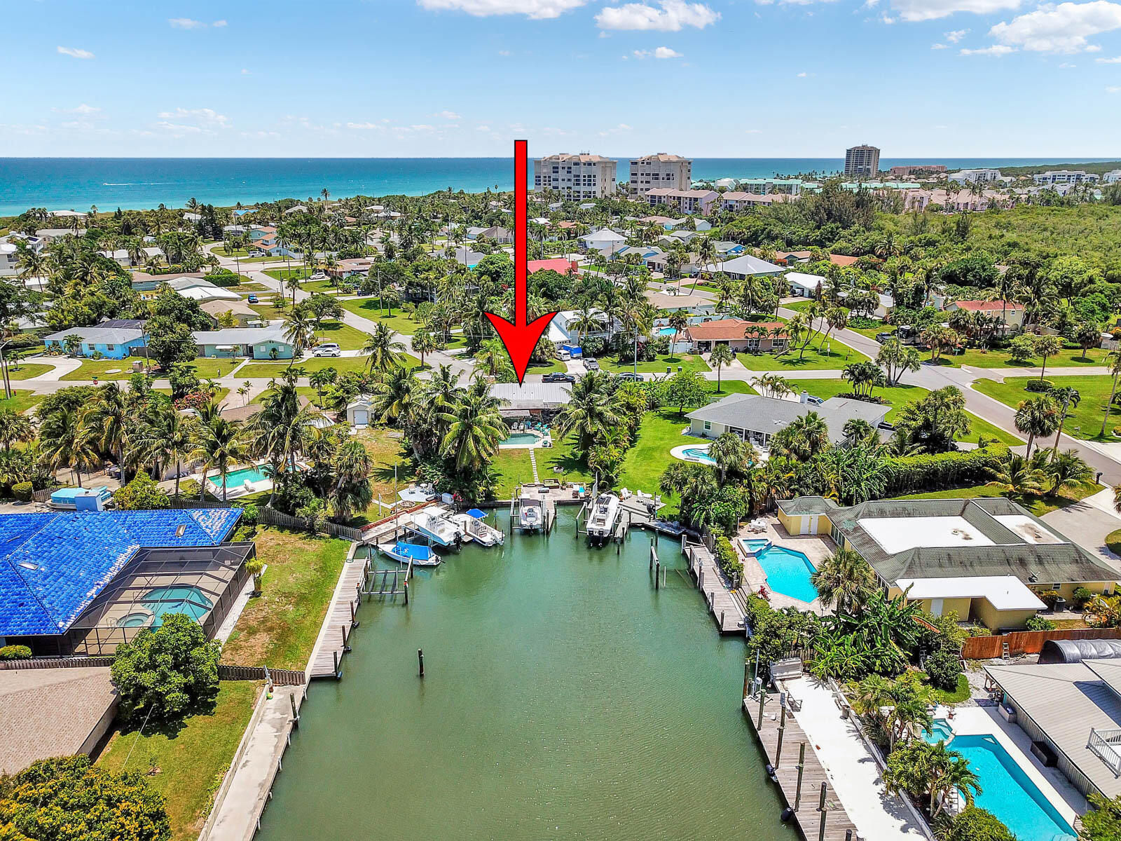 Surf Side has a private beach parking pass $50. a year.  Home has been remodeled.  The pool is redone.  The dock has a lift.  There are no fixed bridges ocean access is near.