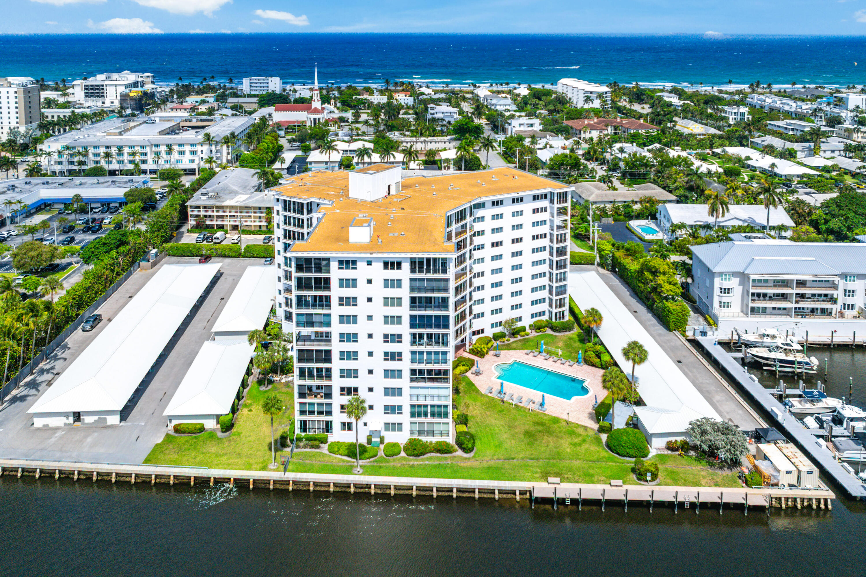 Live the coastal lifestyle from this rarely available direct Intracoastal corner residence in the beautifully renovated Bar Harbour Condominiums. This desirable F-stack 2-bedroom, 2.5-bath condominium offers sweeping Intracoastal Waterway views where you can relax and watch the boats go by from the comfort of your private enclosed balcony.  Beautifully renovated, this luxury Delray Beach condo features porcelain tile flooring throughout, high-impact windows and sliding glass doors, custom closets, and a spacious split-bedroom floor plan designed for privacy and comfort. The designer chef's kitchen is appointed with premium Monogram appliances, including an induction cooktop, custom cabinetry, and elegant finishes,  ideal for entertaining. Residents enjoy the coastal modern renovated  amenities including a welcoming front desk and lobby, waterfront pool overlooking the Intracoastal, coastal club room, fitness center and a library.  A covered carport parking space is included. Ideally located just one block from Atlantic Avenue's renowned shops, restaurants, and nightlife, and only two blocks to the ocean. Experience the ultimate "Village by the Sea" lifestyle in the heart of Delray Beach.