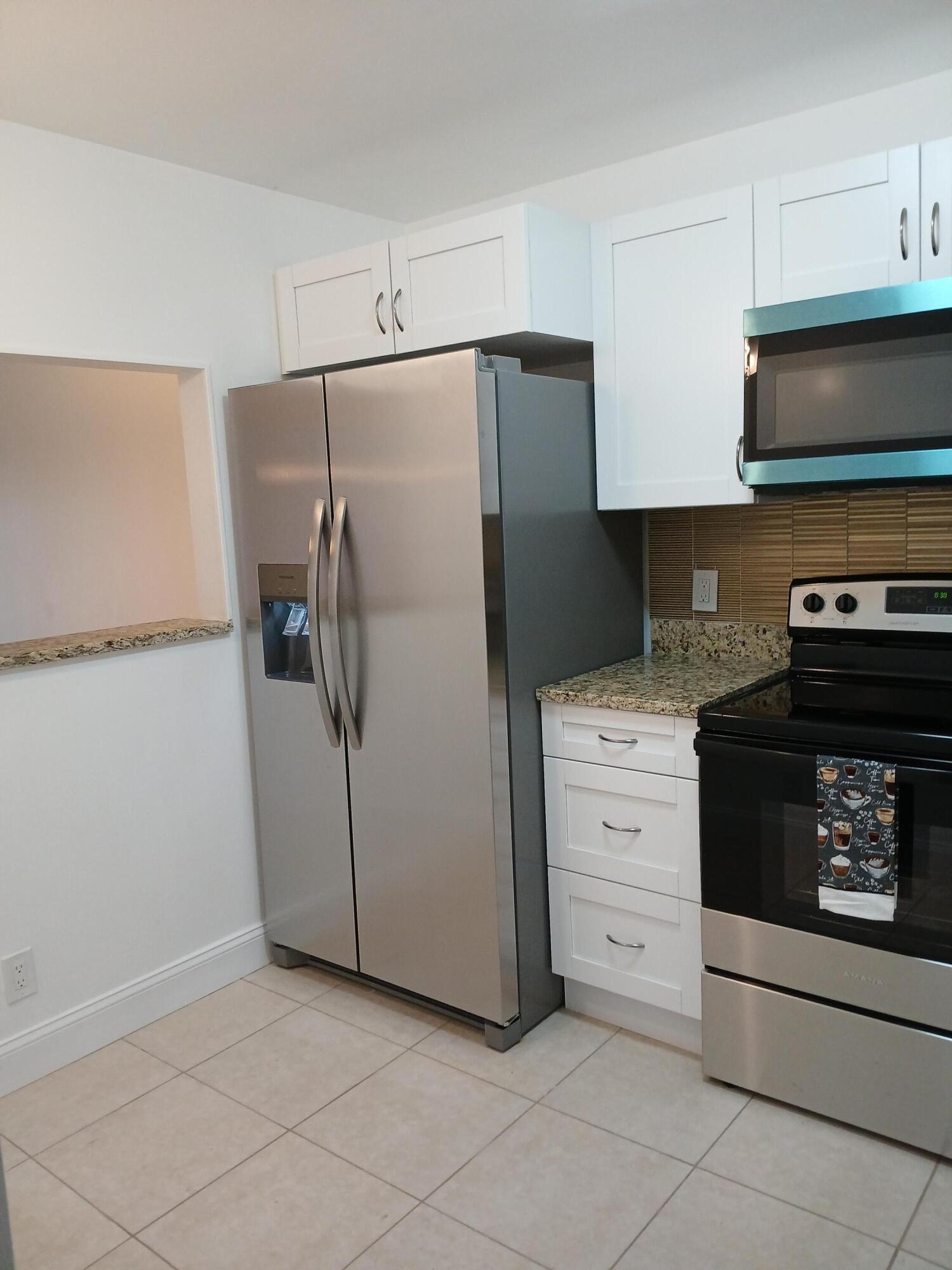 Water and cable included. Beautifully renovated penthouse end unit condo includes brand new kitchen cabinets, granite countertops, brand new stainless steel appliances-side by side fridge, flat top stove, microwave above, dishwasher, all new tile floors throughout, brand new bathroom with new tile shower, new vanity with granite top, comfort height toilet, 2nd bath has brand new comfort height toilet with new vanity and quartz top, new water heater, screened in porch.