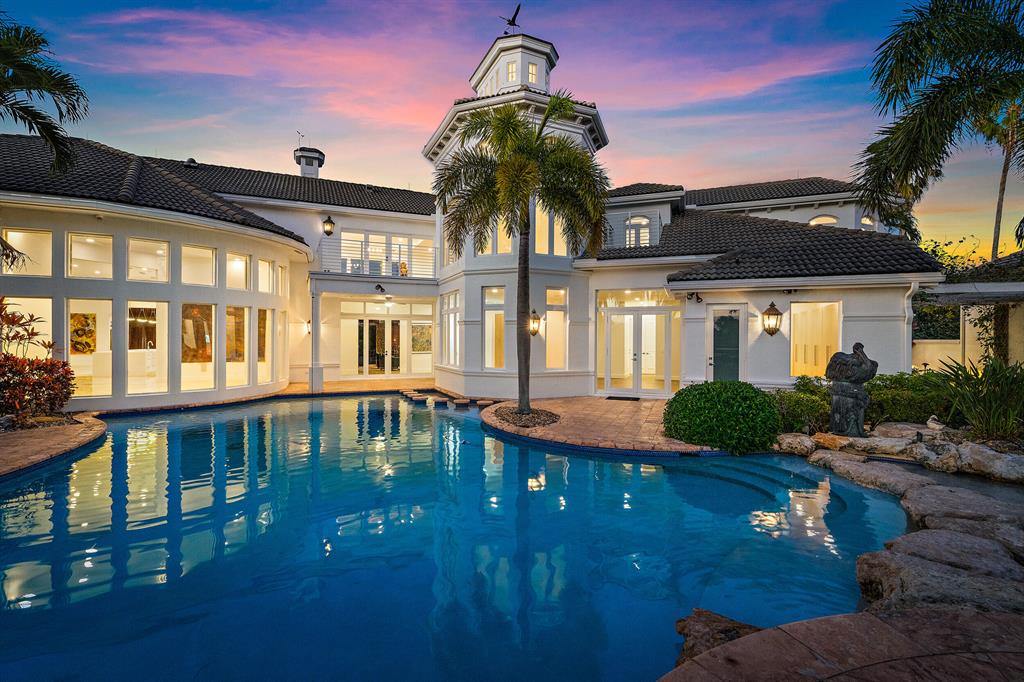 SHOWSTOPPER!  This SPECTACULAR Estate was designed and built for luxury entertainment with contemporary magnificence and prestige. Located in the award-winning community Ibis Golf and Country Club, this sprawling home has recently undergone a remodel and transformed into a modern dream. Sitting on a fantastic oversized lot, this home offers expansive water views, water frontage, and stunning views of the 18th hole on the Jack Nicklaus designed Legend course.

Upon entering the home you will be in awe of the wide, open design and layout. With over 10,700 living square feet and a total of 13,828 square feet, this masterpiece will be sure to leave you amazed. Featuring 7 bedrooms, 6 full bathrooms, and 3 half baths, two executive primary suites, two home offices, 6.5 car garage, gourmet kitchen, resort style pool with waterfall, your own putting green and a guest house that features 2 bedrooms, separate laundry, and kitchenette, PLUS impeccable finishes throughout.  

When pulling up to your extensive residence, you will have two driveways to choose from. The home also has a large GORGEOUS and LUSH green space perfect for any type of outdoor entertainment. Expanding three lots, this home is positioned to offer the ultimate privacy within a bustling community. With both extensive water views as well as views of the fairway!

Enter the home and be prepared to be swept off your feet with an open layout and plenty of natural light. The great room, immaculate chef's kitchen, and stunning dining room offer commanding views of the inviting outdoor entertainment areas, pool and golf course. Gather around the MASSIVE (17'x5') kitchen island with gorgeous white quartzite waterfall countertops. Worthy of any Michelin chef, the kitchen features state-of-the-art appliances including natural gas range, smart refrigerator, and double ovens.

The main floor of the home offers two executive primary suites, each with magazine worthy built-in his and hers closets in each suite, bathrooms complete with white marble floors and showers, and inviting soaking tubs. Two additional bedrooms, each with an ensuite bathroom, a family living area, two offices, and a PUTTING GREEN round out the main level.

Take the elevator or stairs to the upper level to discover another suite, complete with one and a half bathrooms, kitchen, living and entertainment areas, bedroom, and portico with FANTASTIC views.

The guest house adds two more bedrooms, a bathroom, separate laundry, living area, and kitchenette. Don't miss the opportunity to own the STUNNING home in one of the most desirable communities in the area. Schedule a private viewing today!

Make your way outside to your spacious back patio adorned with an outside bar set up with all the summer kitchen necessities, such as, charcoal grill, ice machine, and fridge. Relax with friends and family by the outdoor fireplace or sprawl out by the resort style pool with sun shelf.

10870 Egret Pointe Lane offers every LUXURY you can imagine, a 6.5 car garage with extensive built-in storage, elevator, putting green, impact windows,  sonos surround sound throughout, two first floor master suites, outdoor gas fireplace, Jerusalem marble flooring, 6 zoned ACs, and MORE.

Ibis Golf & Country Club is a luxurious, award-winning country club community voted Best in Palm Beach County offering memberships that include something for everyone in the family to enjoy whether it's a game of golf, a day by the resort-style pool, or a massage in the beautifully appointed spa. Situated in West Palm Beach, Ibis provides both the serene country club vibe as well as the cosmopolitan feel of the city with close proximity to world-class restaurants, extensive shopping, nightlife, and South Florida's beautiful beaches. Club and equity membership required with golf, tennis, social, and other membership packages available.
 
 
Other notable features include:
- Nearly 14,000 square foot estate
- 6.5 car, oversized garage spaces with extensive built-in storage
- Impact Glass throughout
- Resort style pool with sun shelf
- Outdoor entertainment spaces, gas fireplace, summer kitchen, 
and cabana bathroom
- Six total en suite bedrooms
- Guest house with 2 bedrooms, separate laundry and living spaces
- Spectacular views of the 18th hole on the Jack Nicklaus designed Legend course 
- Second floor Cupola with stunning views
- Elevator
- Jerusalem Marble Flooring 
- Putting Green
- Sonos Surround Sound
- Second floor balcony overlooking pool and golf course
- 6 zoned A/C units
