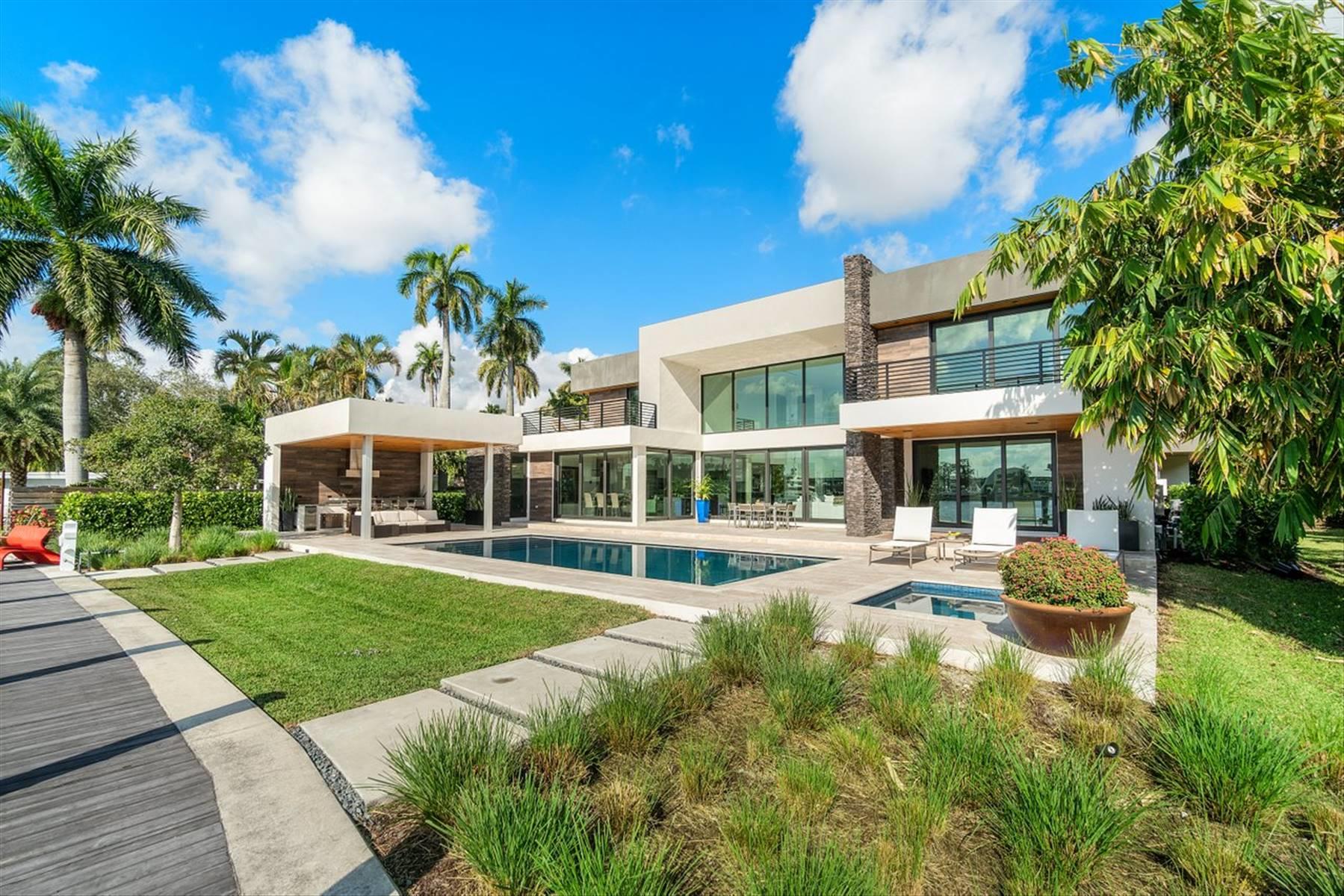 Riverland waterfront ½ acre gated estate, Napa contemporary (2020) Designed by Bruce Celenski Architects built by IDI is stunning, a premium on privacy and security with iron gates and state of the art camera system, 5 bedrooms & 6.5 baths, 3-car garage, expansive walls of custom impact windows & doors,9 ft entry pivot door, Italkraft Italian chef kitchen, Sub Zero & Wolf appliances, level 5 quartz, porcelain baths ,elevator, floating walnut staircase, 500 bottle wine wall, A/C units (4) with individual thermostats,Kohler Stance fixtures, Lutron smart home system, 48 x 24 porcelain tiles, hide a hose vac system, Kohler 38k,1,000 gal gas tank, oversized pool with salt system, heated, separate spa, guest house, oversized outdoor kitchen, amazing views of mega yachts on large basin New River.