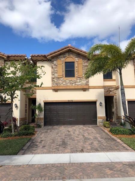Large 4 bedroom 3.5 bathroom townhouse in Town Parc. Over sized unit with all impact windows and expansive water views. Upgraded kitchen with stainless steel appliances, beautiful flooring throughout, private backyard with one of the longest lake views, and 2 car garage. Second floor has 4 bedrooms and 3 bathrooms. Master features large walk-in closets, separate tub/shower. 1 bedroom has an on suite bathroom. Laundry located upstairs. A rated schools, full amenities, clubhouse, gym, playground, pool and access to amenities at the 2 state of the art club houses.