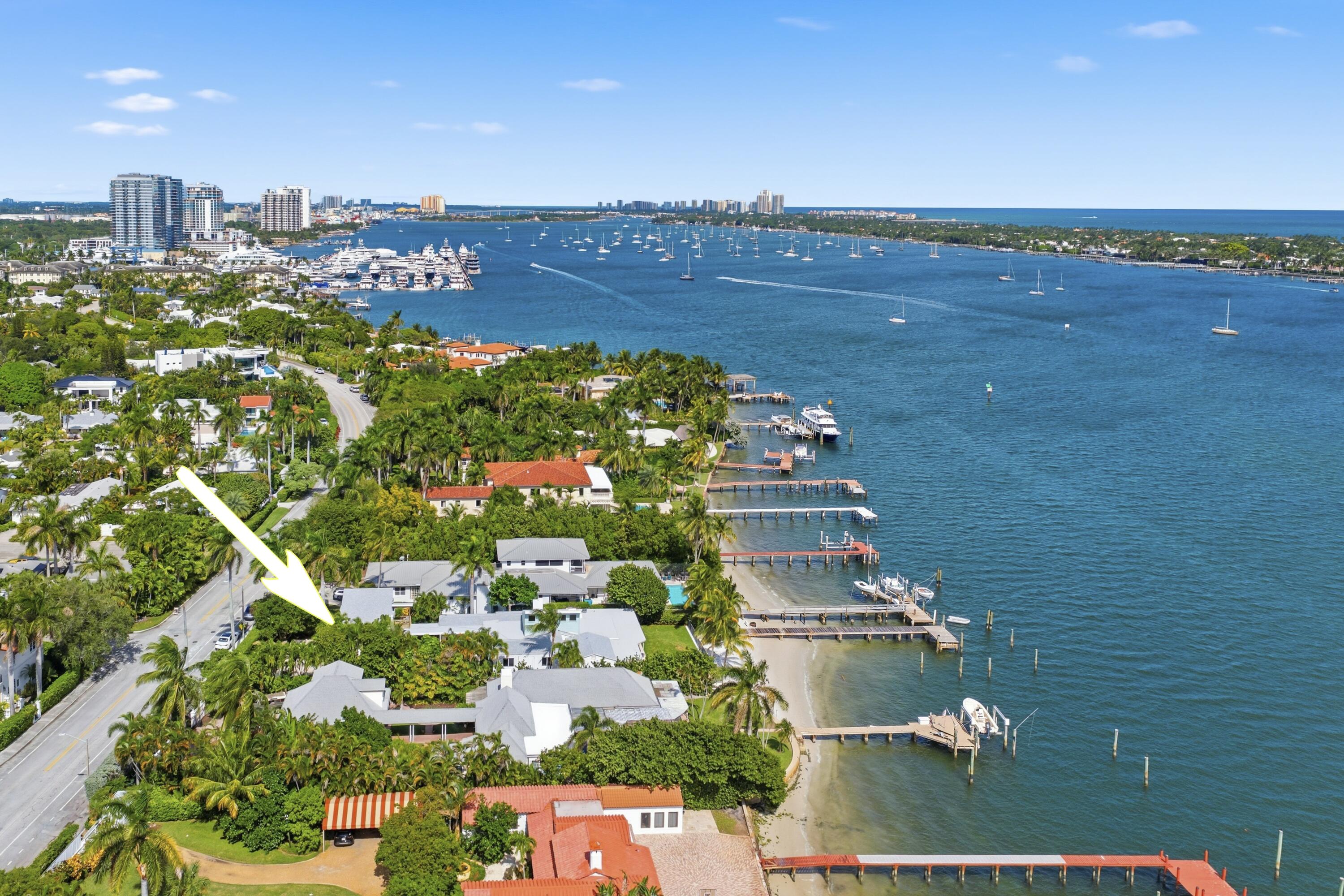 Direct Intracoastal.  Freshly renovated 5 bedroom/4 bath pool home with guest house, two car garage, dock, impact windows, and a new roof (2025) . Experience amazing Intracoastal and Palm Beach views from all major rooms in this fabulous single story home with vaulted ceilings in the living room, and an eat-In kitchen and family room with Intracoastal views ... Watch the yachts floating by on the way to the Palm Beach Inlet just minutes away.  With a private  beach, all situated on a 17,498 sq. ft. Lot.  It's just perfect and Truly a Rare Find! Move in and Enjoy!