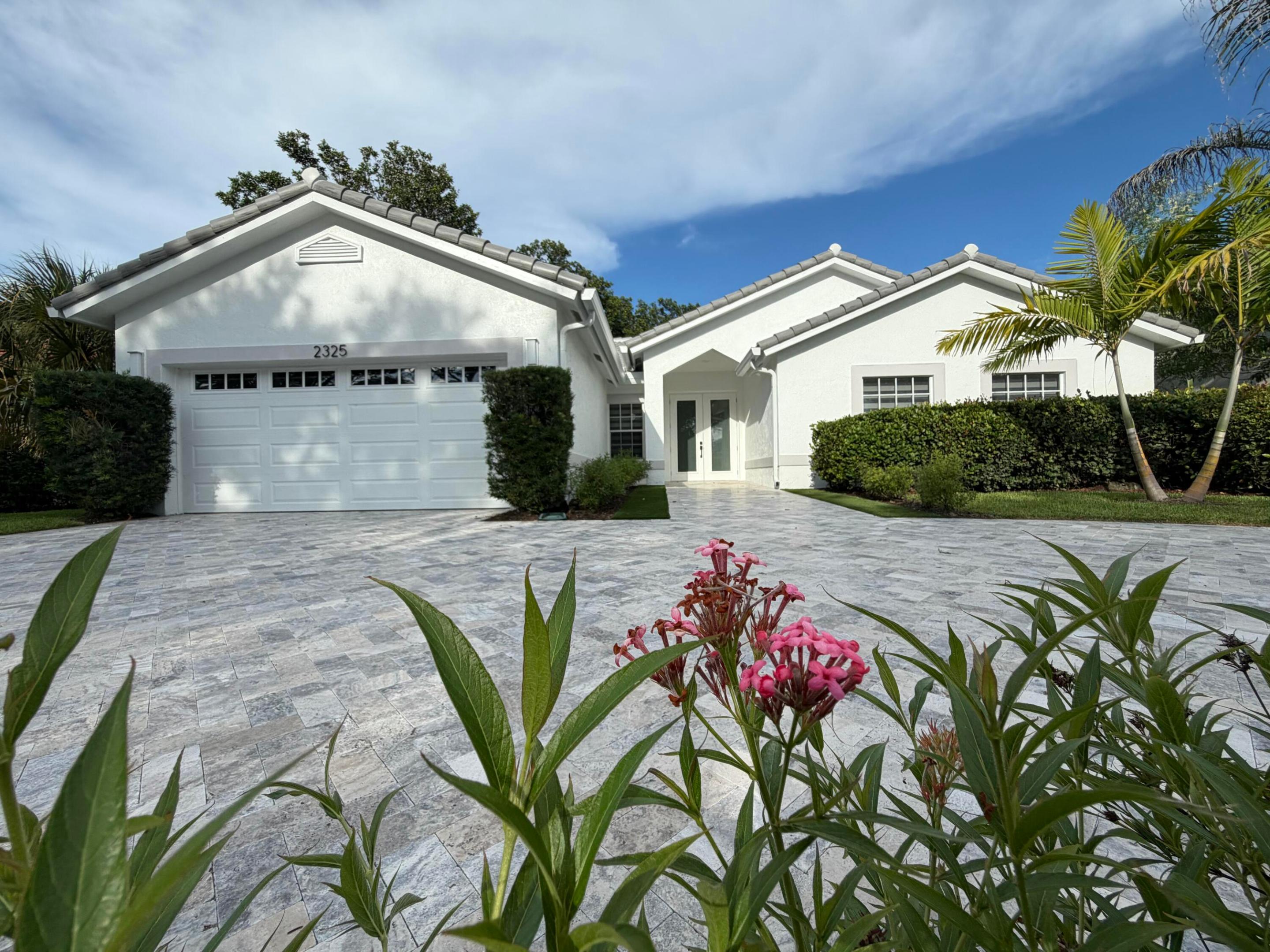Beautifully renovated 4/2 home in the heart of Coral Springs! Move-in-ready and completely updated with modern finishes like tile flooring throughout. Stunning new modern kitchen and new KitchenAid stainless steel appliances.The spacious primary suite offers a luxurious en-suite bathroom, dual vanities, and a generous walk-in closet. Secondary bathroom features a tub/shower combination with dual Jack-and-Jill vanities; plenty of space for family or guests. New circular paver driveway offering ample parking, in addition to 2 car garage. Screened in patio and large yard. near top-rated schools, parks, shopping, dining, and major roadways.