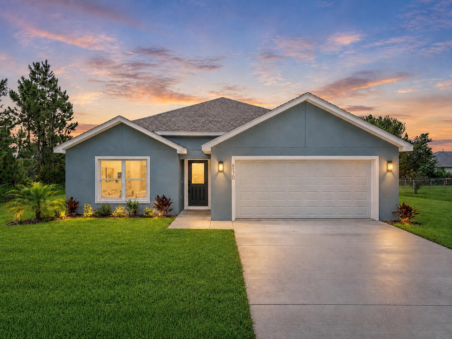 Welcome to the 'Palm' Model, a beautifully crafted, brand-new four-bedroom home in the highly desirable Sun 'N Lake Golf Community. Offering 1,665 square feet of thoughtfully designed living space, this residence blends modern style, everyday comfort, and exceptional functionality.  At the heart of the home is a striking 'Harvest Oak' kitchen featuring warm wood-tone cabinetry, elegant quartz countertops, contemporary hardware, and a complete stainless steel appliance package. The kitchen opens seamlessly to the dining and living areas, creating a bright, inviting space ideal for entertaining, gathering with family, or simply enjoying daily life.  Luxury vinyl plank flooring extends throughout the main living areas and bedrooms, while the bathrooms showcase oversized high end tile for a  sophisticated, contemporary finish. Modern LED lighting, stylish fixtures, four well-proportioned bedrooms, in a desirable split layout along with two full bathrooms, and an attached two-car garage.  Outside, professionally installed landscaping enhances the home's curb appeal, while a three-zone irrigation system with a Hunter automatic timer helps keep the property looking its best year-round. Central water and sewer, along with underground utilities, provide added convenience and peace of mind.  Sun 'N Lake offers an amenity-rich lifestyle with two championship 18-hole golf courses, a community pool with an expanded pool planned, pickleball and basketball courts, playgrounds, a dog park, and scenic recreational trails.  Conveniently located near AdventHealth, shopping, dining, schools, and everything Sebring has to offer, this move-in-ready home is an exceptional opportunity to enjoy stylish new construction in one of the area's most sought-after communities.  *Some photographs have been enhanced with digital staging.*