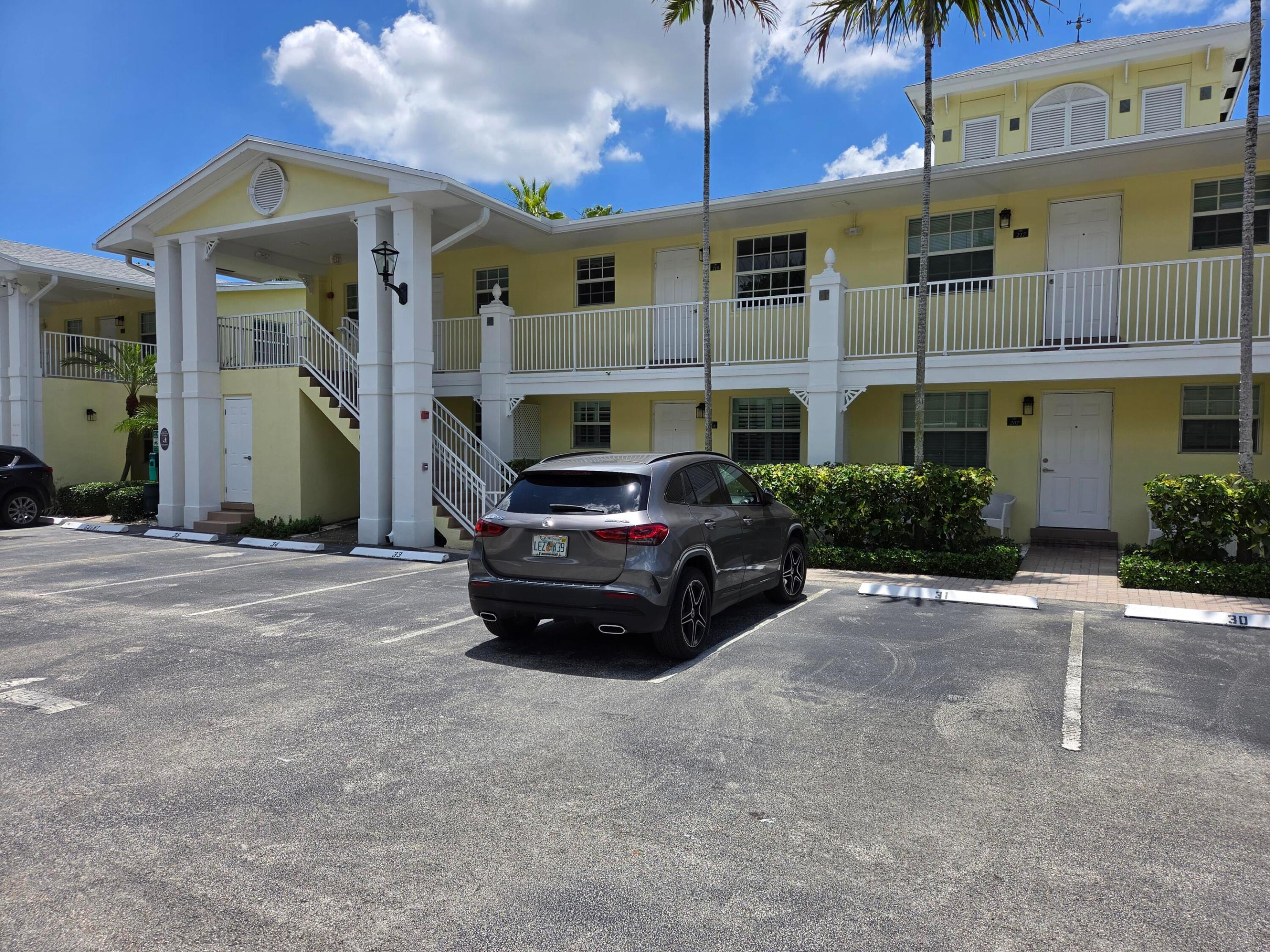 Location! Location! In the heart of vibrant Wilton Manors, The Grove is a gated pet friendly community with reasonable maintenance fees. This bright corner second floor unit offers a versatile two bedroom layout with space for a den, office, guest room or any extra private space you desire. Enjoy soft neutral tones, granite counters, stainless steel appliances, upgraded lighting, bath and door fixtures and hardware, refinished knockdown textured ceilings, and additional windows that fill the home with natural light. Dishwasher and water heater replaced in 2023. Features include central A/C, high impact windows, your own assigned parking space in front, and a community pool. Walk to shopping, restaurants, and nightlife while still enjoying a tucked away residential setting.