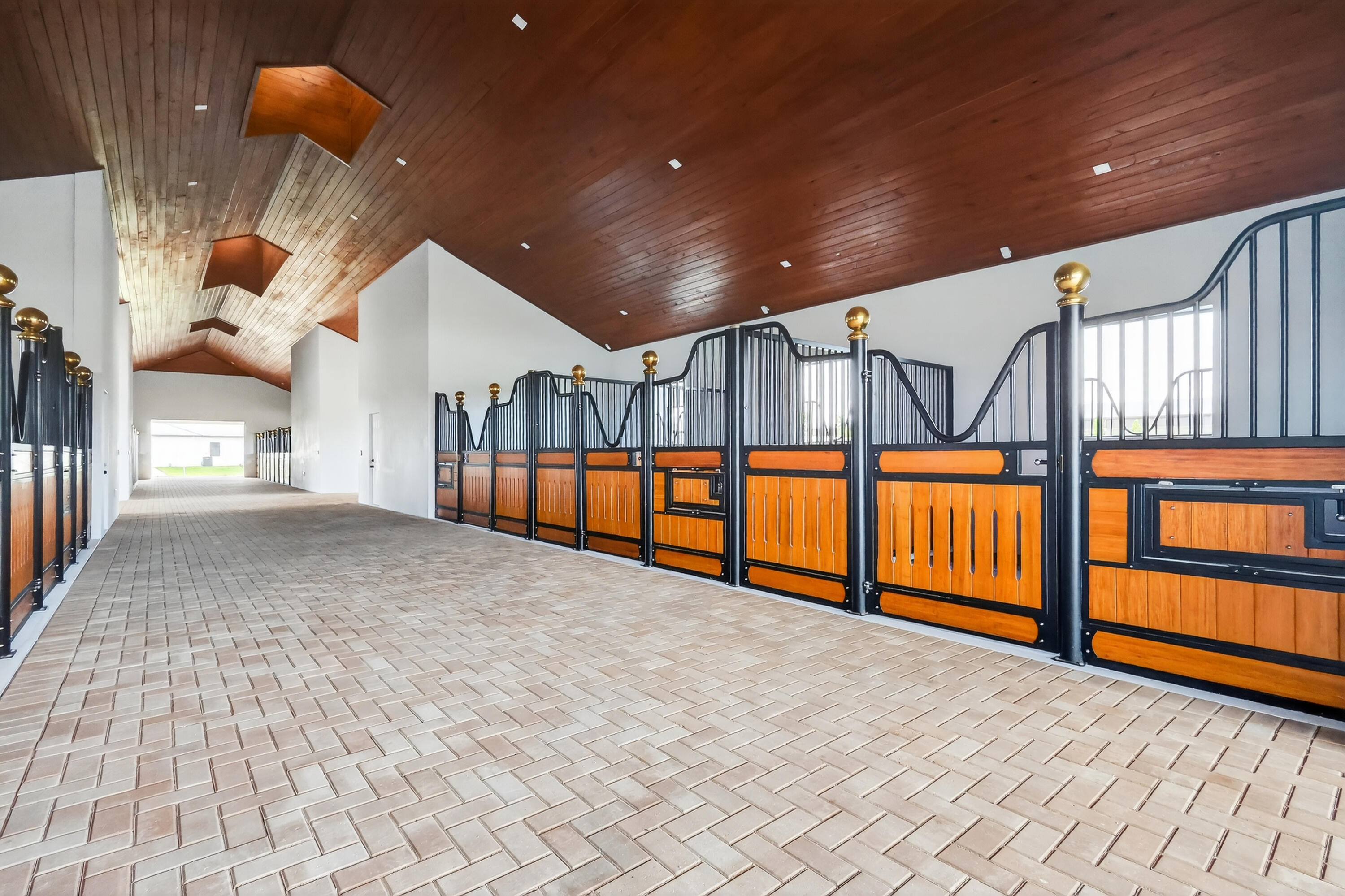 Exceptional new construction equestrian estate  The property features single-family home and a fully equipped horse facility with 12 stalls, rider's lounge with guest room, 1.5 baths, office, laundry, tack room, and a covered arena with lighting and training mirror.The main residence offers 4 bedrooms, a den/office, and an open-concept design. The gourmet kitchen boasts Taj Mahal quartz countertops, Thermador appliances, induction cooktop, custom-panel refrigerator, and custom pantry.  custom closets, ceramic tile, impact windows and doors, and a whole-house reverse osmosis system.Outside, enjoy a pool and spa, outdoor kitchen with BBQ and wine cooler, paver walkways, and a fully fenced property with gated entrance, combining luxury living with an exceptional equestrian lifestyle. WHITE FENCES EQUESTRIAN ESTATES  GATE code is 5698. Seller will pay 6 months of HOA after purchase.