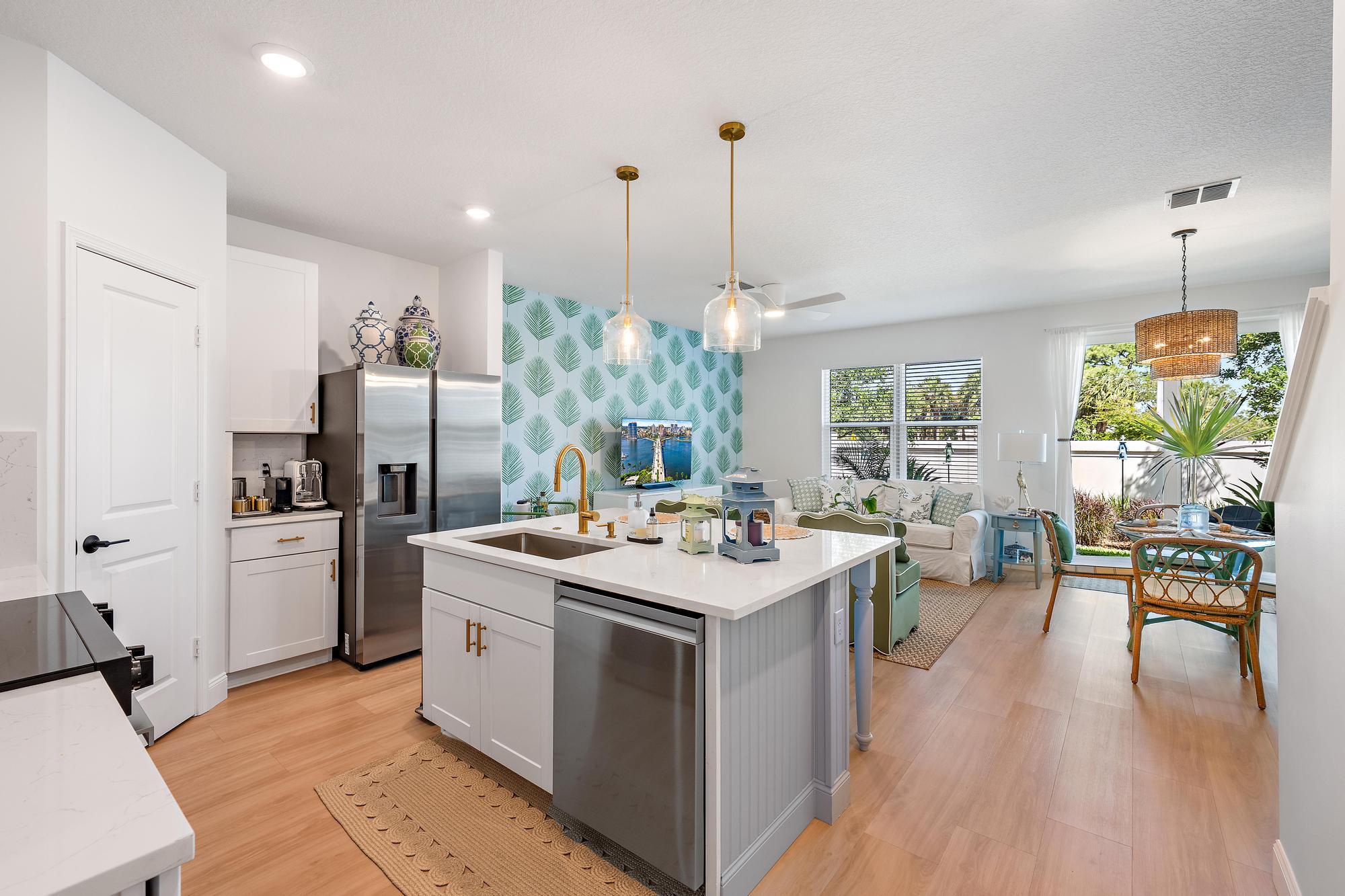 Picture perfect new townhome just minutes from Downtown Stuart. This 3 bed/2.5 bath residence was completed in 2021 and thoughtfully reimagined in 2025. Professionally curated, this home stands out as the most unique offering in the community. Showcasing a Palm Beach inspired design, it features all new flooring, appliances, countertops, and fully updated bathrooms, along with an epoxy finished garage floor. Enjoy lake views from every bedroom and a private backyard with an extended paver patio. Centrally located in the gated enclave of Seaside, residents enjoy a community pool and a pet friendly setting with Poppleton Creek Park just steps away, featuring two dog parks, a small fishing pier, and a lakefront walking trail. Minutes to I-95 & Turnpike, excellent schools and hospitals.