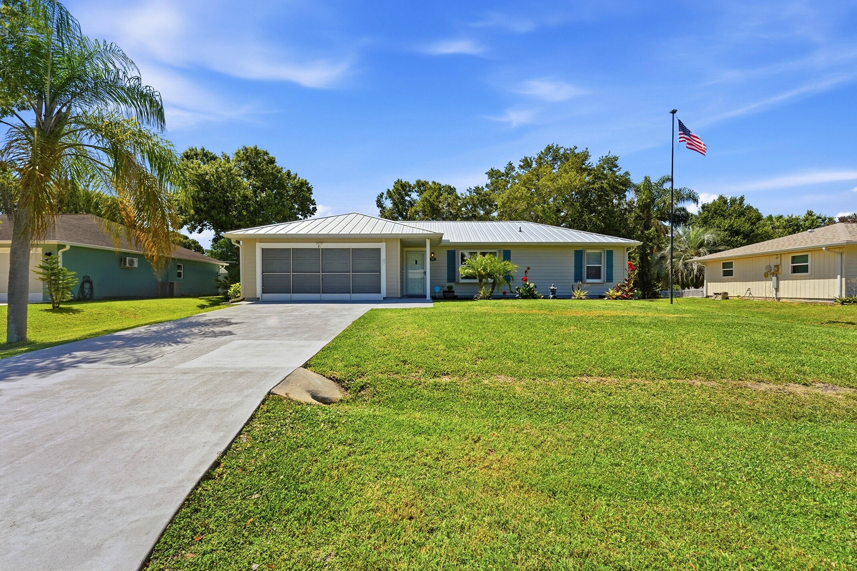 Everything is done. Make this your home sweet home. Perfect for investors, first time home buyers or as a home away from home. New kitchen with lots of cabinet space and large quartz counter island, open floor plan with luxury vinyl flooring, newer metal roof (Dec 2023), remodeled Jacuzzi (brand) guest bath, updated master shower and vanity, quartz counters, sprinkler system, accordion shutters, newer HVAC (2020),  2024 appliances, 2023 washer and dryer, ring camera system, screened patio and an 8x10 (permitted) shed, in a lovely shaded, tropical backyard with room for a pool. This home is located in a quiet neighborhood close to beaches, boating, restaurants, shopping and I-95. Easy to show.  Dog pen does NOT convey. Flag pole does NOT convey.
