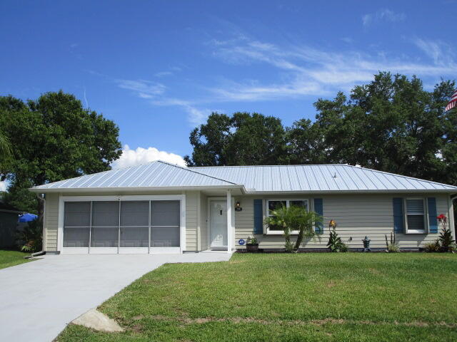 Everything is done. Make this your home sweet home. Perfect for investors, first time home buyers or as a home away from home. New kitchen with lots of cabinet space and large quartz counter island, open floor plan with luxury vinyl flooring, newer metal roof (Dec 2023), remodeled Jacuzzi (brand) guest bath, updated master shower and vanity, quartz counters, sprinkler system, accordion shutters, newer HVAC (2020),  2024 appliances, 2023 washer and dryer, ring camera system, screened patio and an 8x10 (permitted) shed, in a lovely shaded, tropical backyard with room for a pool. This home is located in a quiet neighborhood close to beaches, boating, restaurants, shopping and I-95. Easy to show.  Dog pen does NOT convey. Flag pole does NOT convey.