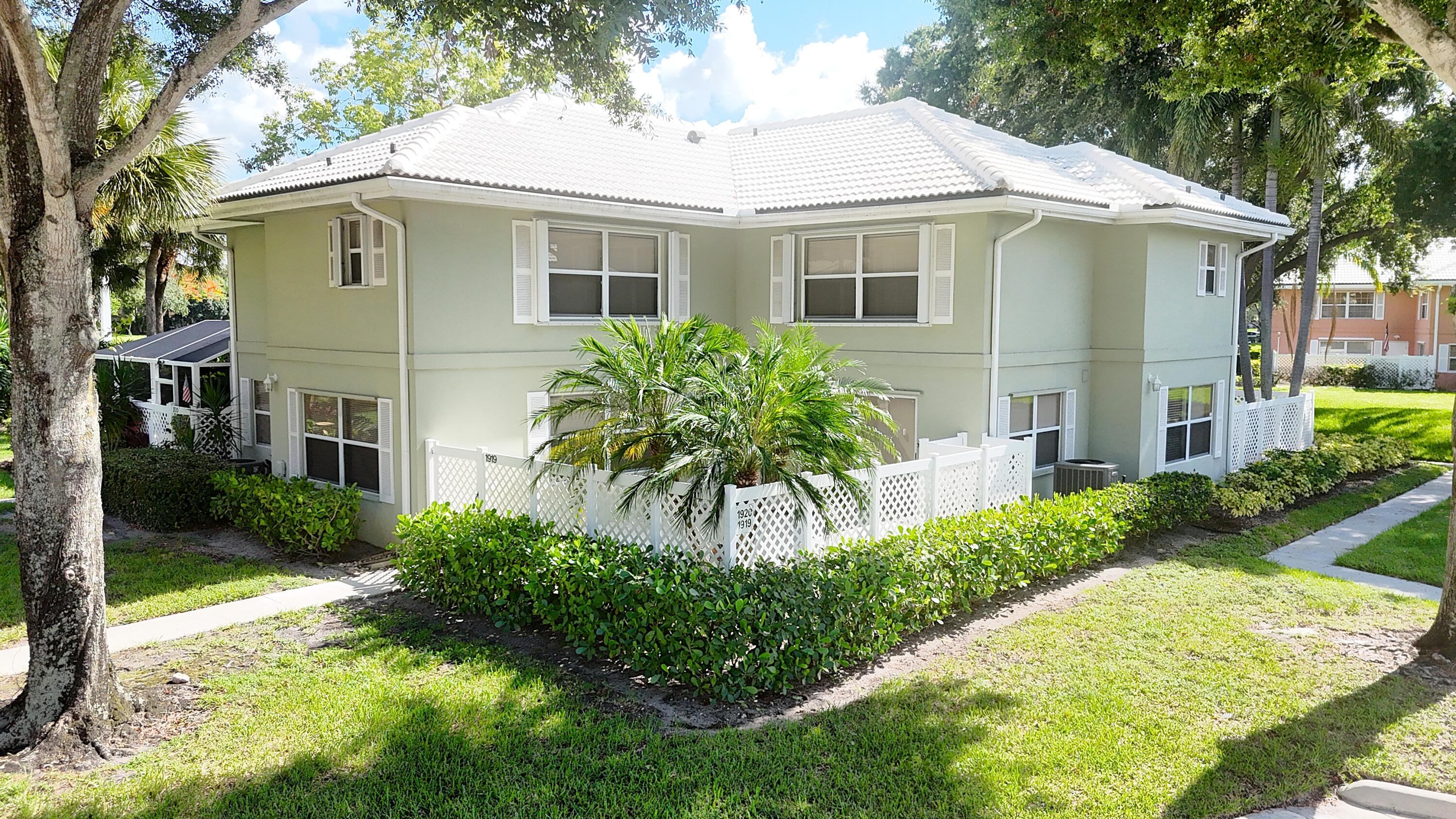 Welcome to 1919 Hartford Court, a beautifully maintained townhome in the desirable Stamford at The Villages community of West Palm Beach. This spacious 2-bedroom, 2-bath residence offers an inviting floor plan with abundant natural light, comfortable living spaces, and a private patio ideal for relaxing or entertaining. The well-designed layout features generously sized bedrooms, ample storage, and the convenience of low-maintenance living. Residents enjoy access to community amenities, including a pool, tennis courts, and beautifully maintained grounds, all while being just minutes from shopping, dining, I-95, Palm Beach International Airport, downtown West Palm Beach, and area beaches. Whether you're looking for a primary residence or seasonal getaway this is an exceptional value! AC Approx 10 years old. Appliances approx 2-4 years old. Roof approx 13 years old. Hot Water tank approx 17 years old.