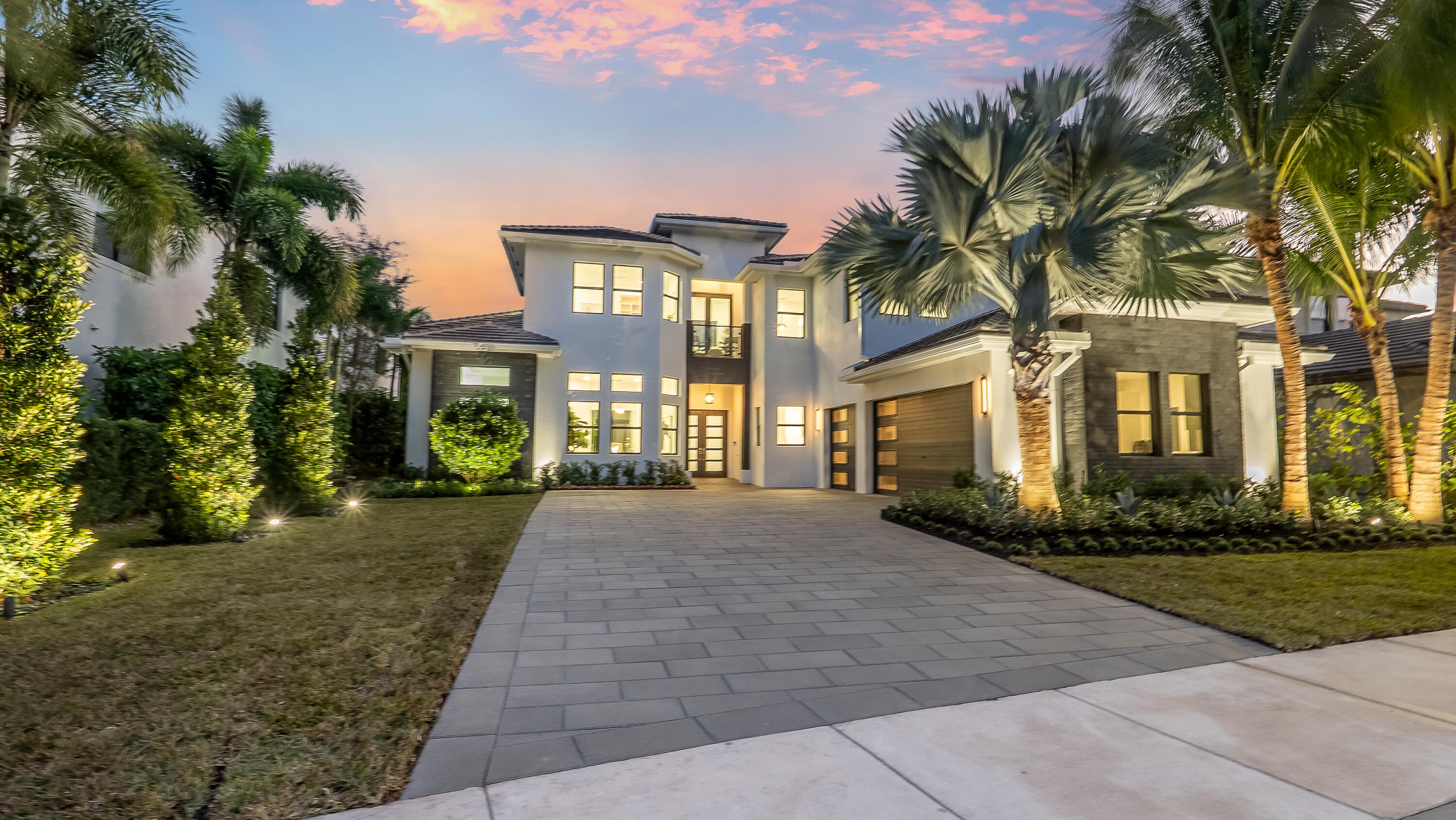 A true architectural masterpiece located within the prestigious Boca Bridges community; this residence has undergone a complete redesign and rebuild with no builder grade materials remaining. Essentially a brand new custom home, the transformation was just completed in December 2025 and reflects an uncompromising commitment to luxury, craftsmanship, and design. Offering an exceptional two story layout, the home includes six bedrooms, seven full bathrooms, two half bathrooms, a private office, a spacious loft, a custom movie theater with Martin Logan surround sound, and a three car garage. The home is introduced by dramatic 48 x 48 Spanish porcelain flooring throughout the main living areas, paired with rich custom Reserve hardwood floors in the bedrooms and along the staircase. Designer lighting and refined finishes are showcased throughout, creating a sophisticated yet warm atmosphere. The custom kitchen is a statement of both form and function, featuring leathered Bianco Rhino quartzite countertops, custom cabinetry, and a professional appliance suite by Wolf, Sub Zero, and Viking, ideal for everyday living and elevated entertaining.
The primary suite is a private retreat, highlighted by a spa inspired bathroom with a luxurious wet room featuring separate his and her showers, a designer soaking tub, Hansgrohe fixtures, and smart EPLO electric toilets. Every bathroom in the home reflects the same level of detail and craftsmanship, finished with imported tile from Spain and premium materials throughout.
The backyard is a true resort style oasis, perfectly positioned on an extremely private south facing lot with no rear neighbors. Designed for entertaining and relaxation, the outdoor space features a fully upgraded pool, an expanded covered summer kitchen with grill and pizza oven, outdoor fireplace, putting green, new turf, lush landscaping, and a full exterior lighting package. Whether hosting gatherings or enjoying quiet evenings, this backyard delivers the ultimate Florida lifestyle.
This extraordinary residence inside Boca Bridges is more than a home. It is a work of art that must be experienced in person to be truly appreciated.