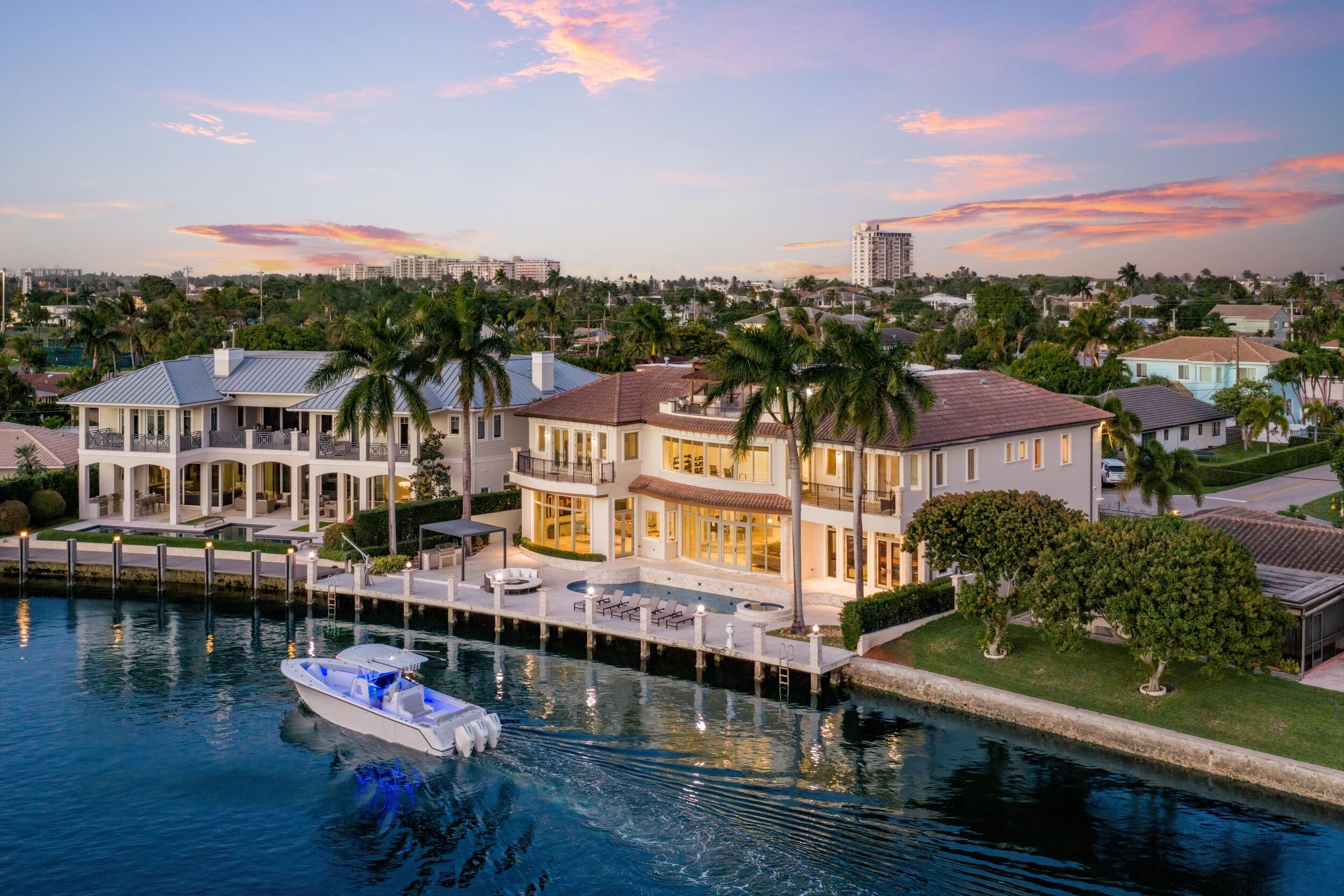 Luxurious Deepwater Gated Estate sited on 103' of frontage with rare wide water views.   Introducing Casa Del Toro, an extraordinary three-story Modern Mediterranean estate set along one of Lighthouse Point's deepest and widest canals, offering over 9,500 square feet of refined waterfront living and 103 feet of equipped deepwater dockage with direct ocean access. Behind gated entry, a dramatic rotunda foyer welcomes with grand floating butterfly staircases, marble floors, intricate ceiling detailing, and an original Murano chandelier imported from Italy. Sweeping water views carry throughout the formal living spaces, raised dining rotunda, expansive chef's kitchen, and sophisticated club room with private bar, creating a home designed equally for elegant entertaining and everyday luxury. The 2,000+ square foot primary suite wing is a true private retreat with a study, dual spa-inspired baths, sauna, oversized dressing rooms, and a waterfront balcony. Additional highlights include a 12-seat immersive theater, elevator, whole-house generator, advanced smart home technology, impact glass, wine storage, and multiple ensuite guest suites. The third level is a standout feature, offering a spectacular sky deck with bar, summer kitchen, full bath, and panoramic sunset views over the water. Outdoors, the resort-style setting offers a saltwater pool and spa, expansive entertaining deck, multiple BBQ areas, fire pit lounge, and generous dockage along the seawall, delivering an unmatched South Florida boating and entertaining lifestyle.    The information published and provided including but not limited to prices, measurements, square footages, lot sizes, features, finishes, and calculations are subject to errors, omissions or changes without notice. All such information should be independently verified. All parties should perform their own due diligence to verify all information.