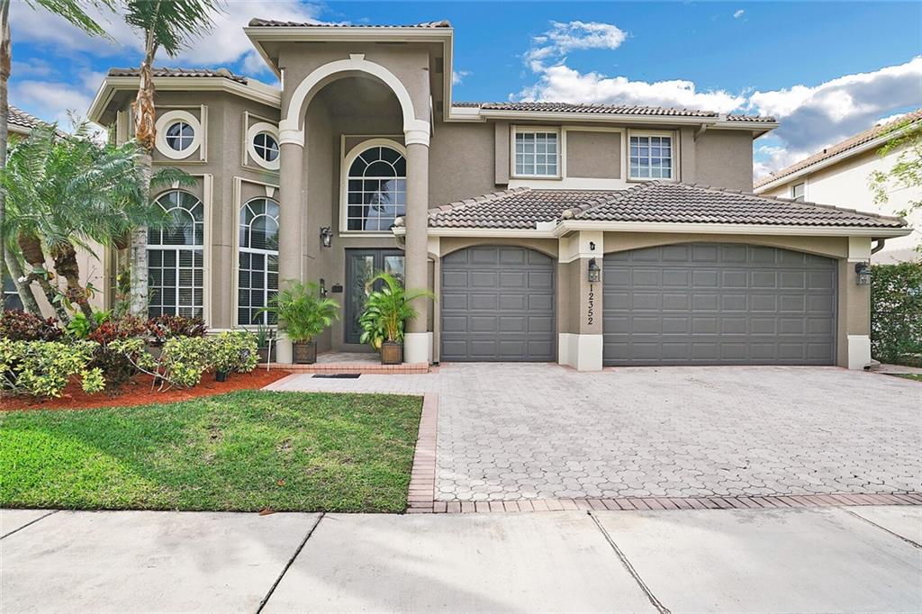 Fully updated forever home in a quiet gated neighborhood. Soaring ceilings in the foyer with a large dining room and living room up front. Kitchen features eat-in area and has been updated with new cabinets, new high end appliances, and granite counters. Open floor plan down stairs. 1 bedroom & full cabana bath down stairs. All bathrooms have been beautifully updated with modern finishes within the last year. High-end wood flooring upstairs takes you to 3 XL bedrooms - all with XL OVERSIZED WALK-IN CLOSETS. Master bedroom features a balcony looking over your serene lake view and patio. XXL walk-in closet in the master bedroom. Master bath features separate vanities and separate tub, shower, and water closet. Don't miss this one!