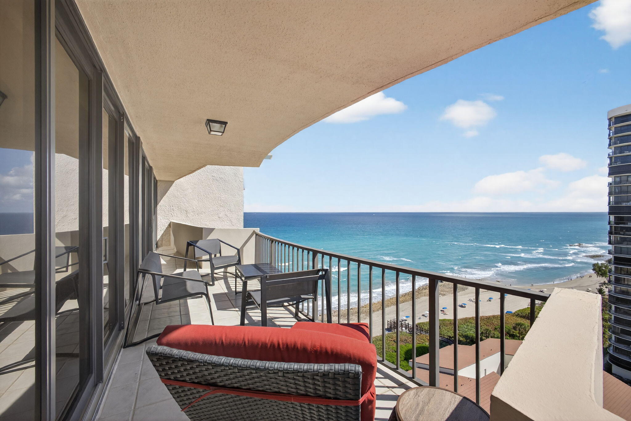 This meticulous, luxuriously fully renovated residence leaves no stone unturned. Located in the beautiful Côte d'Azur, residents enjoy 365-DAY-PER-YEAR MANNED BEACH SERVICE and, of course, EXPANSIVE BEACHFRONT.

The home features new impact windows, porcelain tile throughout the main living areas, and engineered vinyl flooring in the bedrooms. Additional upgrades include a new A/C system, an updated electrical panel, and a custom-designed bathroom with an expanded entrance. Electric shades, custom lighting, and a built-in bookshelf add both elegance and functionality.

Côte d'Azur offers resort-style amenities including a beachfront pool, fitness center, sauna, tennis courts, covered pavilion, and secured entry. One ideal covered parking space (#223) is included.