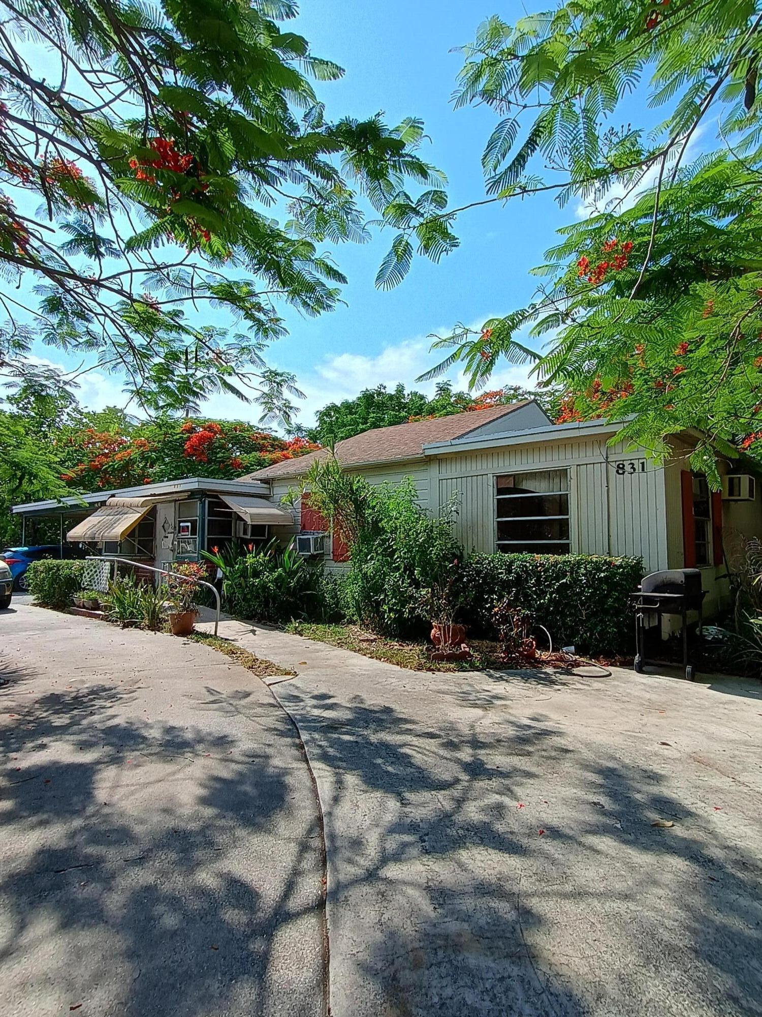 Welcome to this single-story residence located in Forest Ridge Park, West Palm Beach. This two-bedroom, two-and-a-half-bath home offers 1,296 square feet of living space, providing efficient layouts and practical proportions for everyday living. The one-story design eliminates the need for stairs while maintaining all the conveniences of a complete home. Situated in the established Forest Ridge Park community, this property presents an opportunity for those seeking a residence in West Palm Beach. Centrally located in a highly developed area with high commercial activity and upgraded/newer homes. This property has lots of potential and was once used as CLARK FOREST HILL MONTESSORI SCHOOL. Close to I95 and major highways.