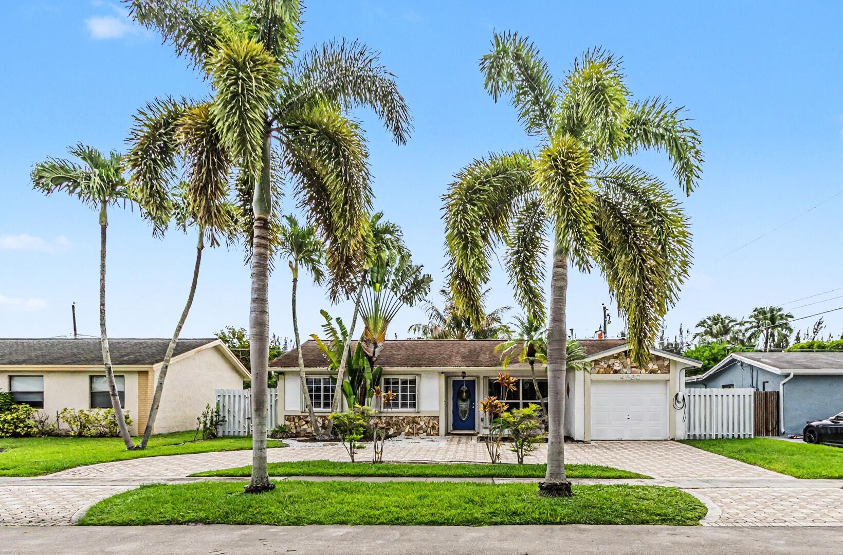 Major updates include, NEW ROOF being installed June 2026 with hurricane-rated skylight & exterior paint. Accordion shutters for all openings and new A/C 2023. This family ready home is conveniently located near Sawgrass Expressway, Sawgrass Mills, and down the street from the renovated Sunrise Athletic Complex. Tastefully appointed with plantation shutters and a spacious family room addition with additional storage. The kitchen offers newer appliances including a gas range and the home has a gas water heater and laundry sink for added convenience. The private back yard offers a large covered patio and room to store a smaller boat or water toys. EV charging hookup ready. Circular paver driveway provides room for several cars. Furniture, garage refrigerator and freezer negotiable. Tesla Charger does not covey - Furniture Negotiable