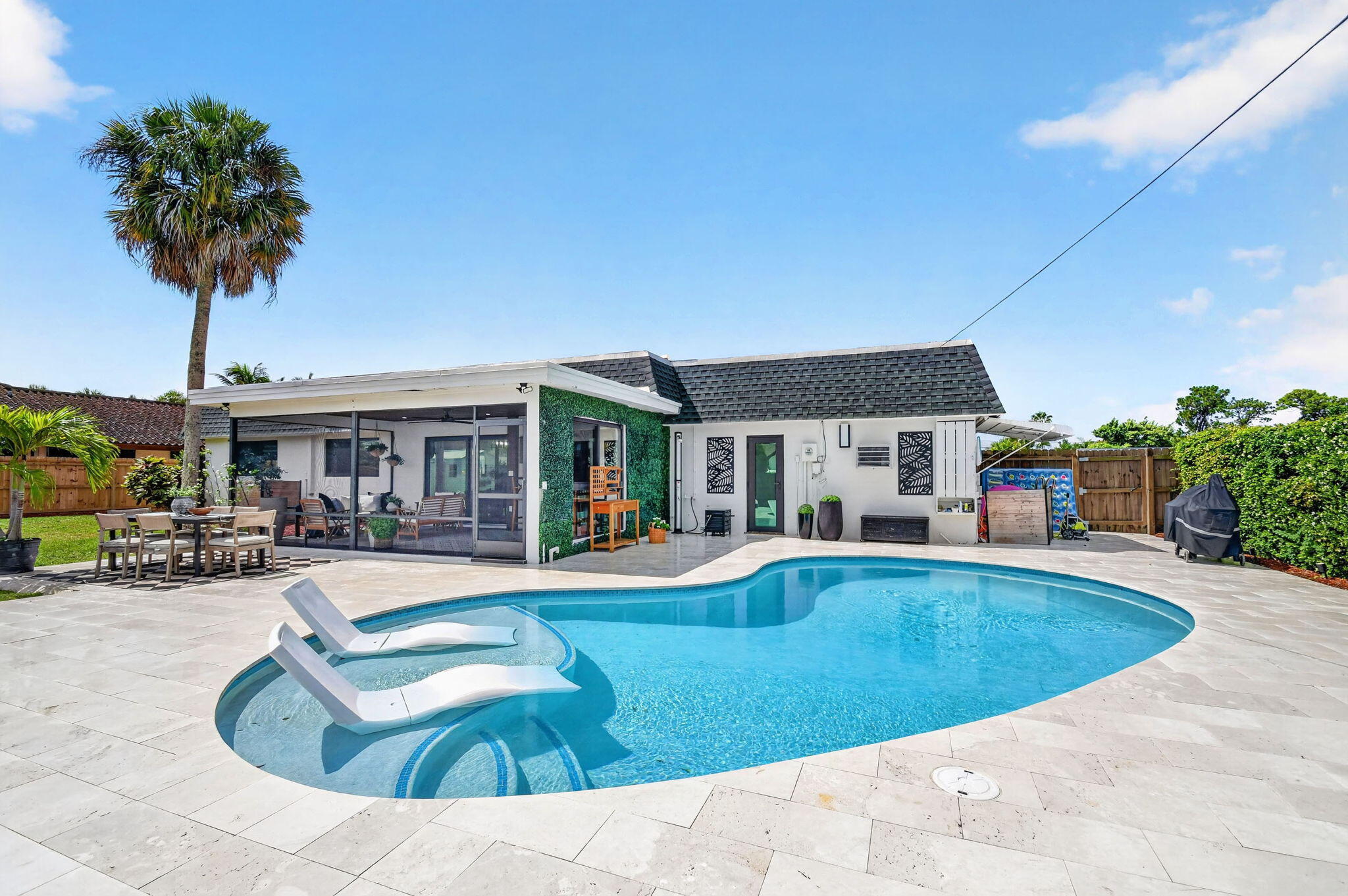 Welcome to this picture perfect home with an open floor plan in the desirable Florida Gardens—A+ school zone and NO HOA. Fully remodeled top to bottom, this lovely home showcases a brand new saltwater pool, a screened in patio, and a travertine deck ideal for effortless indoor-outdoor entertaining. Peace of mind upgrades from 2024 include a new septic tank and drainfield, complete hurricane impact windows, and a brand new electrical panel scheduled for installation next week. Don't miss this move in ready gem- it won't last long!  Please allow up to 3 hours notice for showings. All showings will start on Saturday 6-26-25