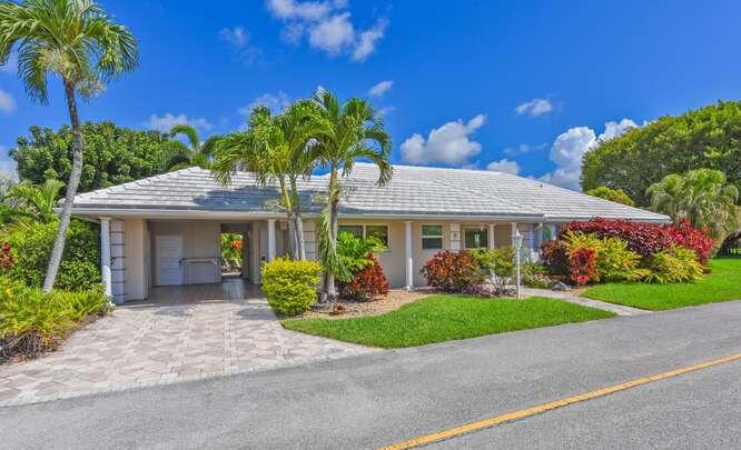 A garden paradise awaits you in the highly sought after French Royale Villas of Atlantis! With a lot size larger than .3 acres, this beautifully designed landscape is a peaceful, inspiring environment to enjoy. The generous villa with 3 bedrooms & 2 baths offers plenty of space to entertain. A newer cement tile roof (2023) with newer gutters and power attic vent, impact windows, updated kitchen & baths, all speak to the pride of ownership of this home. Kitchen Aid appliances with new dishwasher, newer water heater (2021) &  5 ton AC (2018) & continuous ceramic tile on the diagonal throughout. Steps to the adjacent community pool and plenty of guest parking to the left and right of the home offers close convenience. Perfect for seasonal or year round living enjoyment! CURRENT HOME INSPECTION REPORT AVAILABLE.  The city of Atlantis is a gated, manicured country club community offering 2 championship golf courses with no membership required. Enjoy tennis & pickleball at Kintz Park, along with covered picnic areas and water park. Annual events such as the Spring Fling, Egg Hunt, Holiday Golf Cart Parade and BBQ and to the friendly community experience. Atlantis is a Palm Beach county municipality with its own city leaders and police department. Atlantis is conveniently located to I-95, airports,beaches, shopping & restaurants.  DISCLAIMER: The written & verbal communication provided including but not limited to prices, measurements, square footage, lot size, calculations & statistics have been obtained and conveyed from 3rd parties such as the applicable Multiple Listing Service, public records, as well as other sources. All information including that produced by the sellers or listing company are subject to errors, omissions or changes without notice and should be independently verified by any prospect for the purchase of a property. The sellers and listing company expressly disclaim any warranty or representation regarding all information. Prospective purchasers use of this or any written and verbal information is acknowledgment of this disclaimer and that prospects shall perform their own due diligence. Prospective purchasers shall not rely on any written or verbal information provided when entering a contract for sale and purchase. Some affiliations may not be applicable to certain geographic areas. If your property is currently listed, please do not consider this a solicitation.
