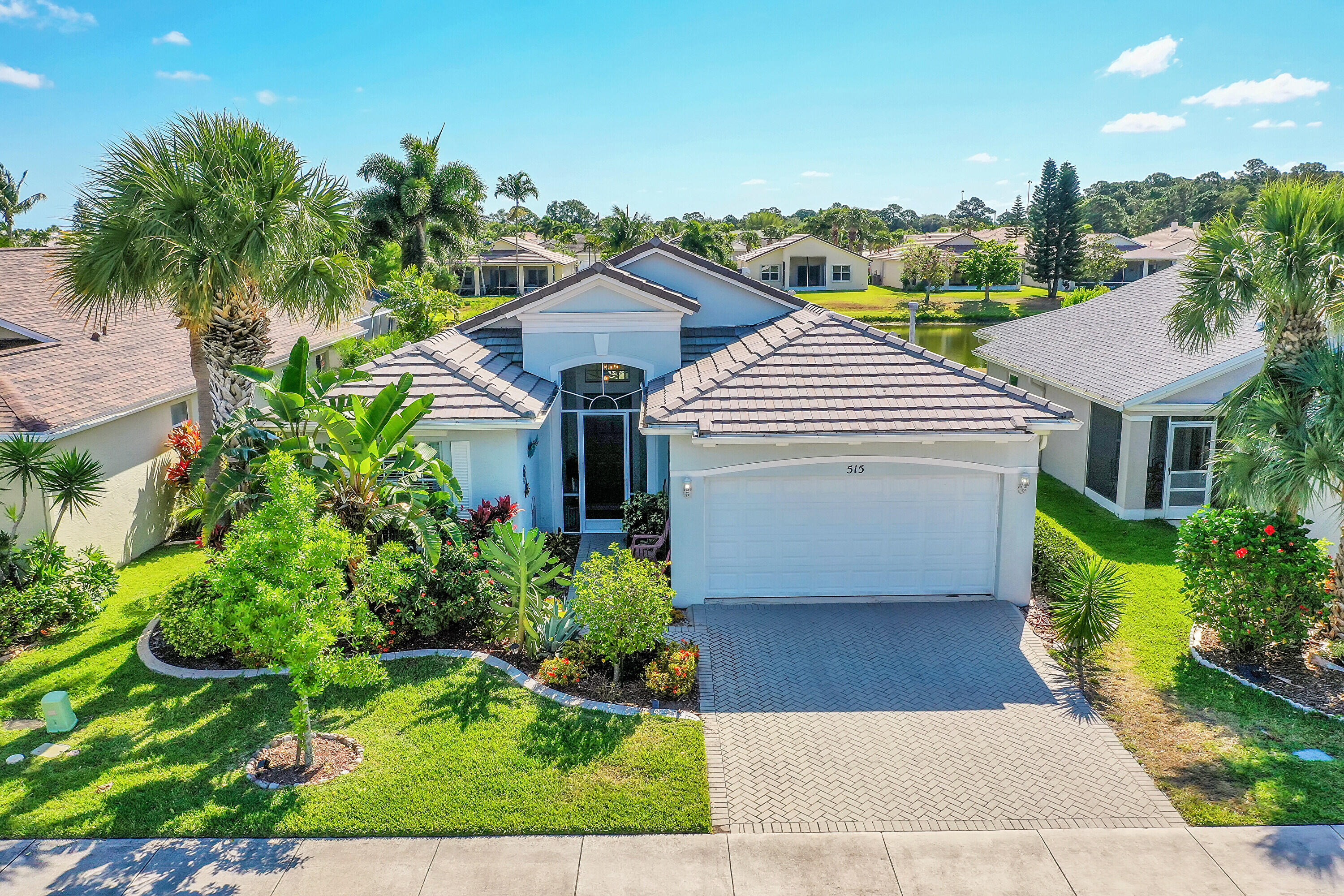 Discover Florida living at its finest in this beautifully maintained 3-bedroom, 2-bath home in the heart of Port Saint Lucie. Featuring a heated pool and spa with serene lake views, this open-concept home offers the perfect blend of comfort and style. Step inside to  high ceilings, beautiful tile flooring, granite countertops, and sleek appliances that make the kitchen both elegant and functional.  Enjoy indoor-outdoor living with spacious entertaining areas and relaxing waterfront scenery right from your backyard oasis. Located in a well-maintained gated community with  LOW HOA fees of only $263/month, this home is ideally situated near shopping, dining, entertainment, the New York Mets spring training facilities, and easy access to I-95 for commuting convenience.  This is the Florida lifestyle you've been waiting for!