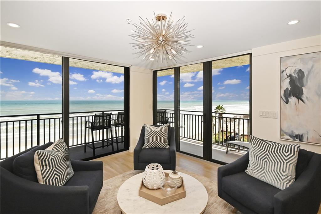 Direct oceanfront southeast corner 3rd floor location, professionally decorated and furnished condo home in desirable Moontide, quite possibly the best view of all! This amazing 3 bedroom 2 bathroom oceanfront condo on the non-drive beach has been completely gutted and professionally renovated with the new popular sexy finishes desired today. Enjoy sunrises on large private east facing wrap around balcony. Open living, dining and kitchen area with 2 walls of windows and sliding glass doors. Kitchen has large 9 ft slab quartz island, lots of cabinets and multi-level lighting throughout. Master bedroom has private south facing oceanfront balcony. Large walk in closet in master bathroom. Upgrades include 72 inch fireplace, auto remote roller shades, $5000 Sonos surround sound system. Moontide offers a gated garage parking, social room, workout area, roof top heated pool with tennis and shuffle board courts. Onsite manager and rental office with great rental history.