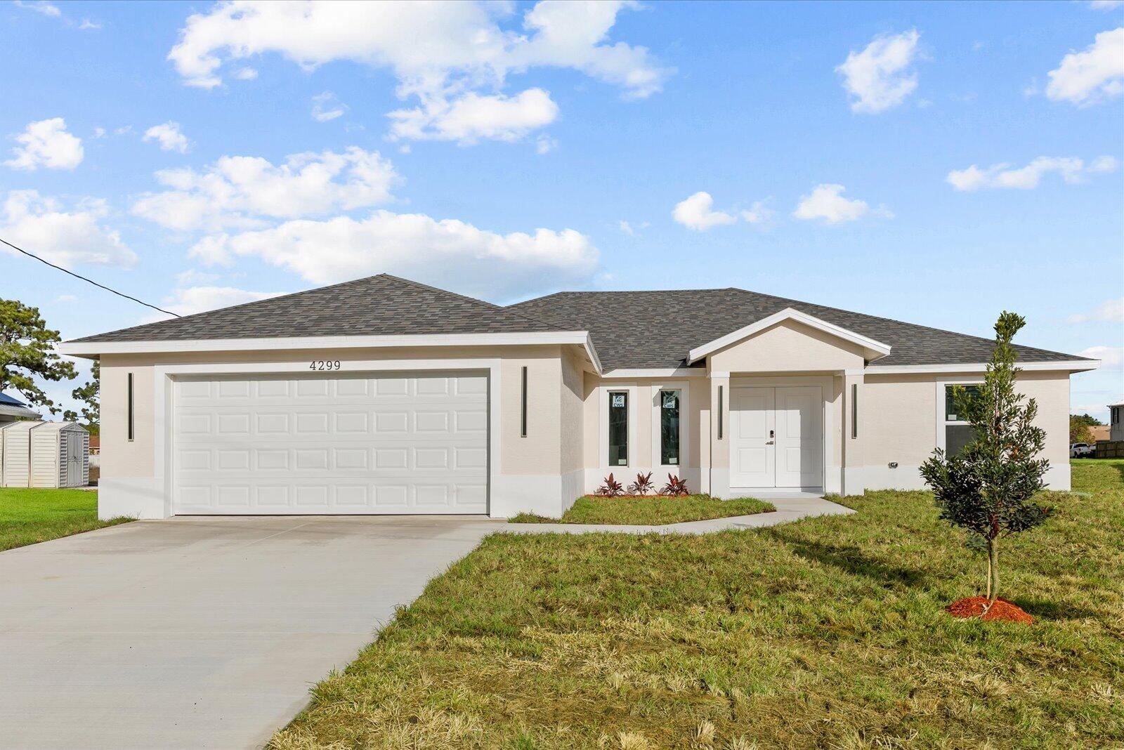 Welcome to this newly built single-family home, beautifully situated on a spacious 14,854 sq ft corner lot with a peaceful backyard view of the canal and plenty of room to add a future swimming pool. This stunning 4-bedroom, 2-bathroom residence combines modern design with everyday functionality. The open-concept layout features porcelain tile flooring throughout, impact windows, and a spacious kitchen with white cabinetry, under-cabinet lighting, quartz countertops, Samsung appliances, a pot filler above the range, and an oversized center island with a sink, glass rinser, and soap dispenser — perfect for cooking, gathering, and entertaining. The bright great room and dining area flow seamlessly to the patio, creating an ideal setting for indoor-outdoor living. This home offers comfort, style, and convenience in one beautiful property