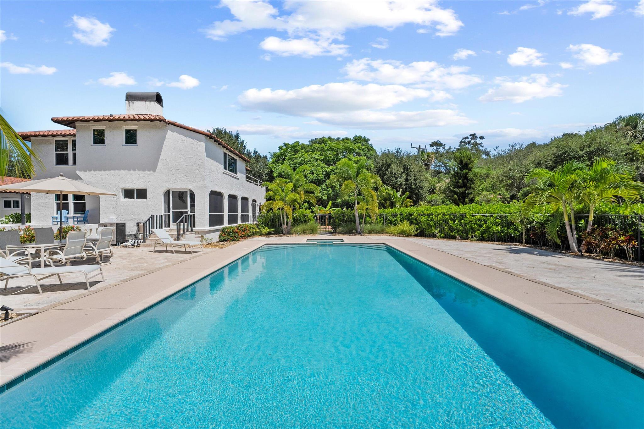 Welcome to this unique coastal sanctuary. A rare find offering the largest area of land available along the Port Sewall coast. This immaculate 1925 Mediterranean home with upgrades rests on 3.66 acres of pristine coastal land. The property consists of 7 parcels that include a beautiful 4 bedroom, 3.5 bath 2 story main house, detached 4 car garage, and separate 2 story guest house on 3 center parcels, 2 story dwelling on 1 adjacent parcel, 1 waterfront parcel, and 2 vacant parcels. An impressive 159' of direct waterfront on the highly sought after cove of North Lake with deepwater access just minutes away. This protected cove lies just inside the St. Lucie River and is a straight run to the St. Lucie Inlet. The relaxing breezes off North Lake can be enjoyed in the sun room or by the pool.