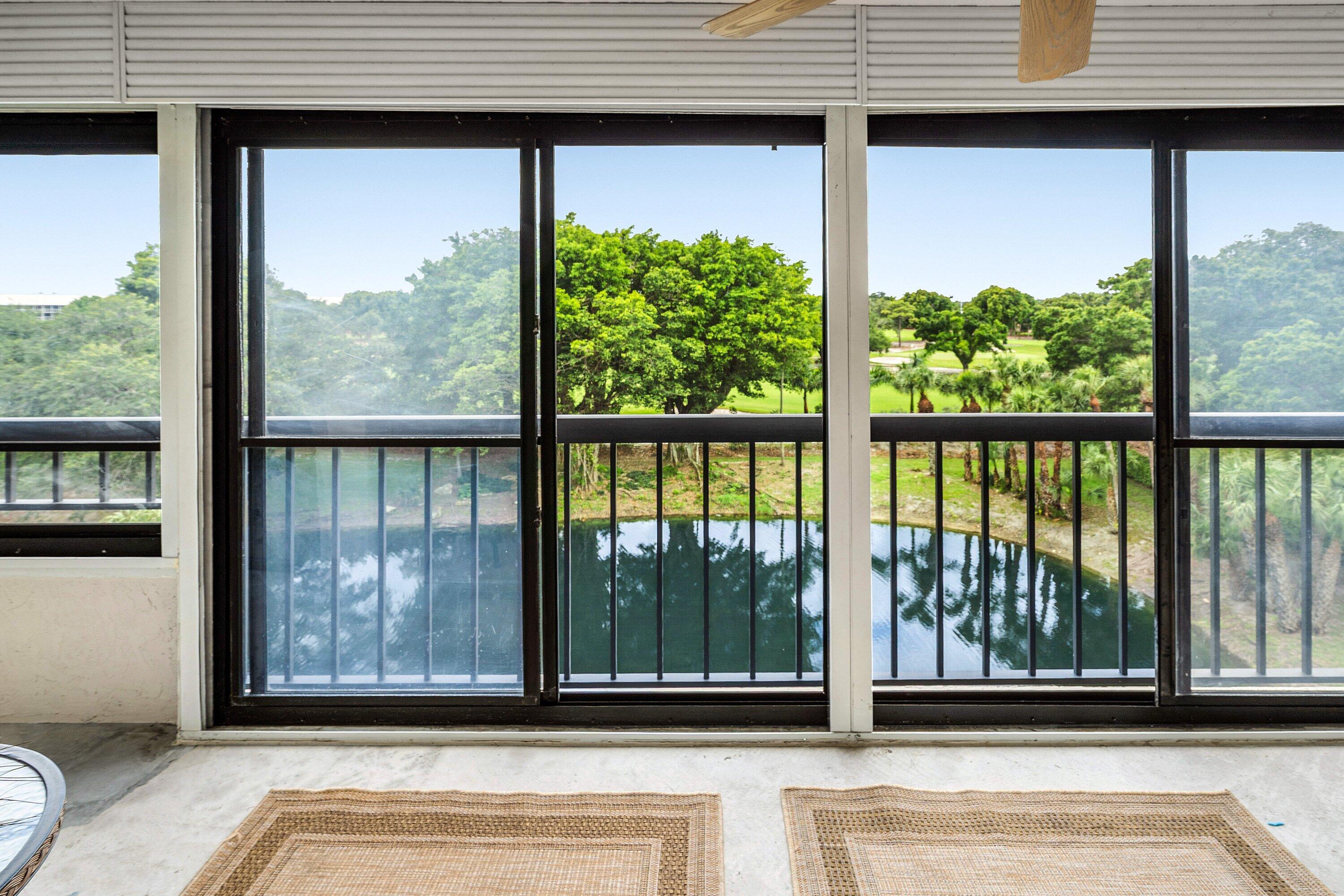 Rarely available 5th-floor residence in The Glens at Boca Del Mar, where a wall of sliders opens to a private screened porch framing serene views of both the shimmering water and the Via Mizner golf course beyond. This light-filled 2-bedroom, 2-bath condo lives larger than its footprint, with a generous open living and dining area, a spacious primary suite, and abundant closet and storage space throughout. Major systems are done: a newer A/C (2018) and water heater (2022) mean move-in-ready peace of mind. Location is the headline. You're minutes from Town Center at Boca Raton — South Florida's premier shopping destination, anchored by Saks Fifth Avenue, Nordstrom, Neiman Marcus, Bloomingdale's and 200+ shops and restaurants. World-class healthcare is close at hand, with Boca Raton Regional Hospital (Baptist Health) just a short drive away and West Boca Medical Center, MD Now Urgent Care, and countless medical offices nearby. Quick access to I-95, the Turnpike, Florida Atlantic University, golf, dining, and the beaches puts the very best of Boca right at your doorstep. This gated community offers resort-style living with a clubhouse, heated pool, and outdoor jacuzzi — plus on-site management to handle any issue promptly. A rare blend of comfort, convenience, and an unbeatable Boca Raton address.
