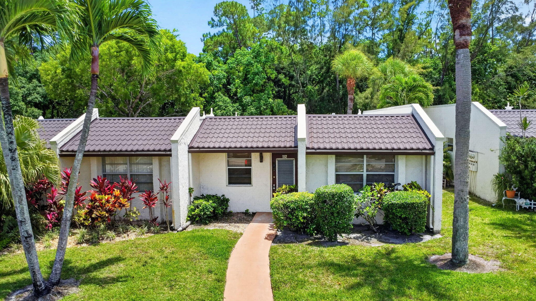 Discover easy Florida living in this beautifully updated 2BR/2BA corner villa. This corner unit offers added privacy, abundant natural light, & a comfortable layout designed for everyday living & entertaining. The interior features tasteful updates throughout, creating a move in ready opportunity for buyers seeking style & convenience. Enjoy a spacious living area, updated kitchen, & split bedroom design.  Located in Golden Lakes Village, residents enjoy resort style amenities including a clubhouse, pool, fitness facilities, social activities, & scenic pathways. Conveniently located near shopping, dining, medical facilities, parks, & major roadways. Offering comfort, lifestyle, & value, this is the perfect opportunity to enjoy South Florida living at an affordable price.