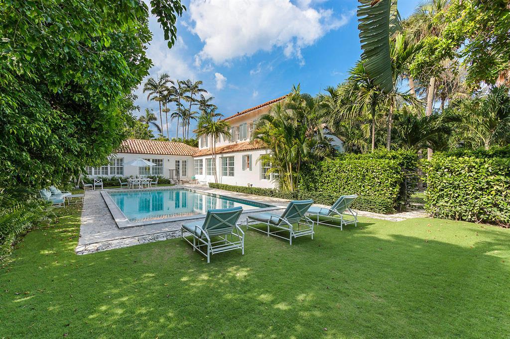 On ocean block in the prized estate area, you can enjoy an award-winning designer decorated renovated villa for the upcoming Season!  Master suite is on first floor.  Fabulous oversized pool and patio.  Well scaled living areas with high ceilings.  Light, bright and value priced to sell! Beach access.