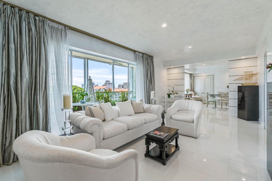 This spacious ultra chic home has been designed with meticulous attention to every detail.  The elegantly defined entry foyer and exquisite hand-painted finishes are reminiscent of the grandeur and luxury of an elegant Parisian apartment. This high floor double unit boasts a gracious primary suite with ensuite bath, an adjoining sitting room, an office with built-in cabinetry and copious closets.  The formal dining room is perfect for entertaining.  On the opposite end of the apartment is the guest suite complete with ensuite bath and access to the beautifully landscaped open terrace.  Enjoy expansive East, South and West views from the glorious terrace as well as from the apartment's interior spaces. This jewel box of an apartment has 3 full bathrooms, a washer/dryer and abundant closets.  This unique offering is a rare find in one of Palm Beach's most sought after Premier In-town Condominium Properties.