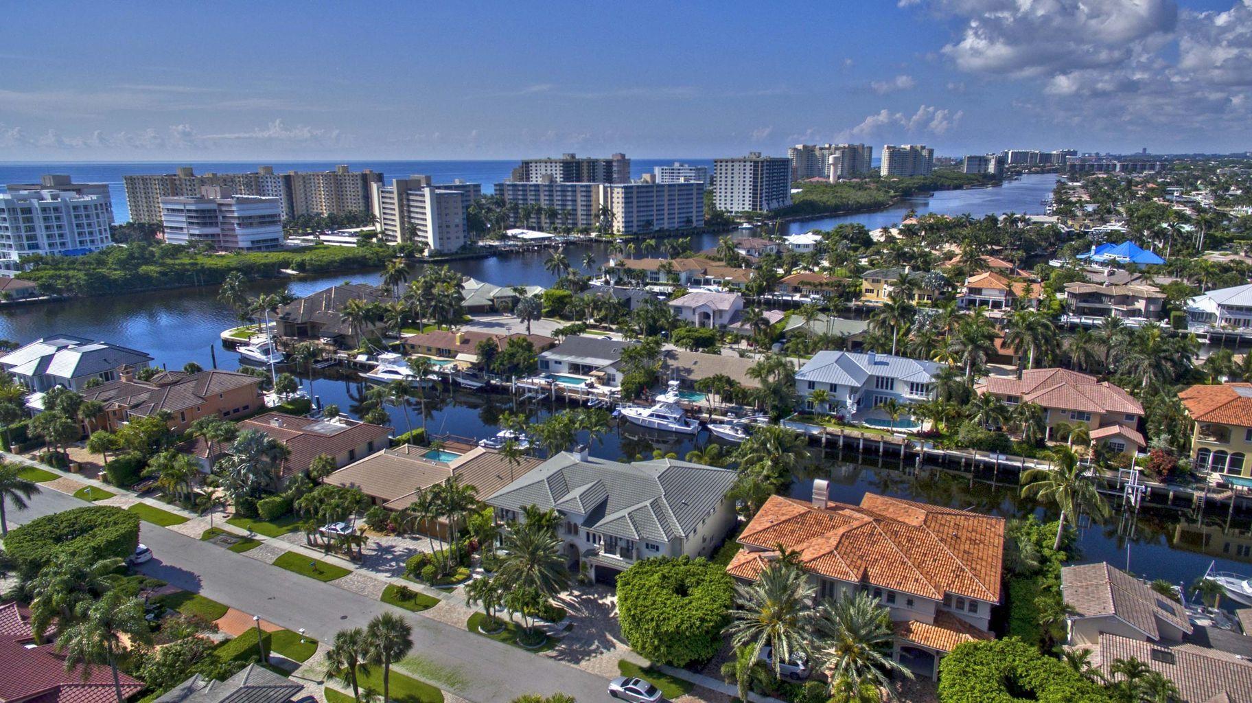 2 Story Deepwater Masterpiece on extra wide canal and south exposure.  Master suite on the first floor. Cherry wood library, gym, elevator, fireplace, wine room, approx. 110' wide canal, underground utilities, sidewalk, waverunner dock, 2 ladders, pool heater. Yachtsman's Paradise. Turnkey negotiable. Seller will consider a trade.