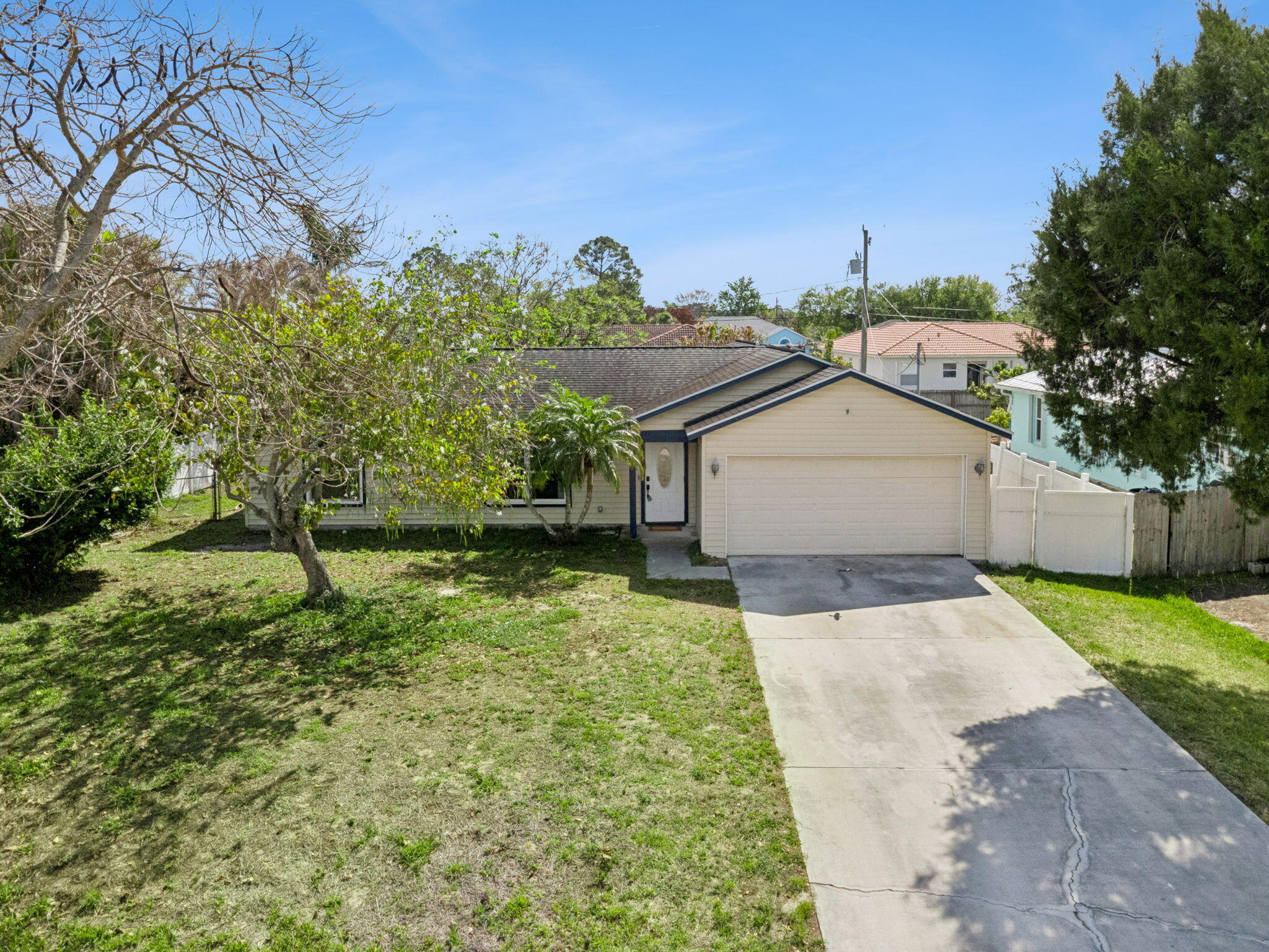 Well maintained 3BR/2BA home in desirable Gatlin Pines—NO HOA and a relaxed Florida lifestyle with room to truly live your way. Ideally located east of I-95 with convenient access to pristine beaches, shopping, dining, and everyday essentials. Bright, open layout showcases an updated, stylish kitchen overlooking the main living area, with dedicated dining space and an inviting family room perfect for entertaining or comfortable daily living. Split-bedroom plan enhances privacy, featuring a serene primary suite on one side and two well-appointed guest rooms on the other. Newer A/C and water heater provide added confidence. Expansive yard offers ample space for outdoor living, pets, or future enhancements.
