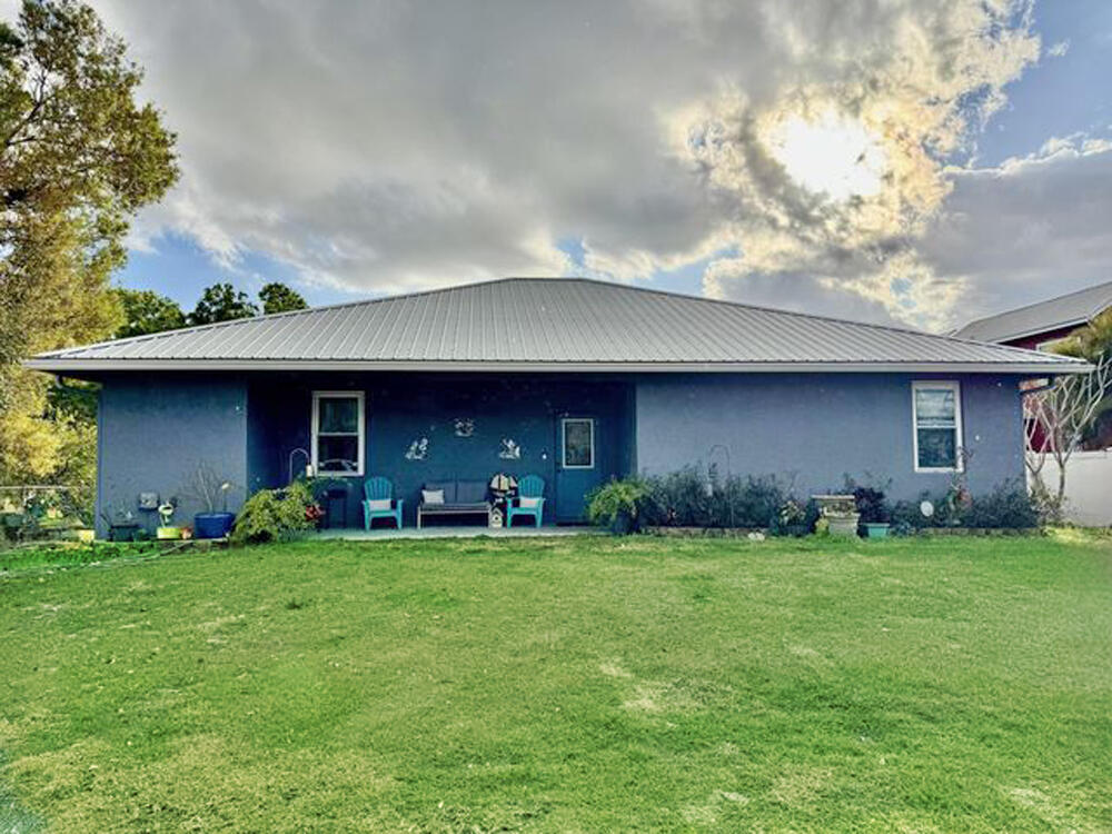 RIM CANAL TREASURE!  2018 CBS Home - Lake ''O'' access. 3 Bd/ 3.5 Ba POOL home.  3 en-suites. Foyer, Open concept, split plan, 10' ceilings. Island kitchen, gas stove, SS appliances and French doors.  2567 Sf under air - 2944 TLA. IMPACT windows, Metal roof, Titan tankless HWH. High efficiency home.  Utility room w/ pantry.  Enclosed Saltwater pool. 800 SF detached garage workshop w/ 240kw. 2019 Spacious wraparound Covered Dock w/10x22 walkway, FC station, private slip, and Seawall. 10Ft wide boat clearance. The FISHERMAN'S DREAM! 
Interior Photos coming soon.
Dimensions are approximate, must measure for exact