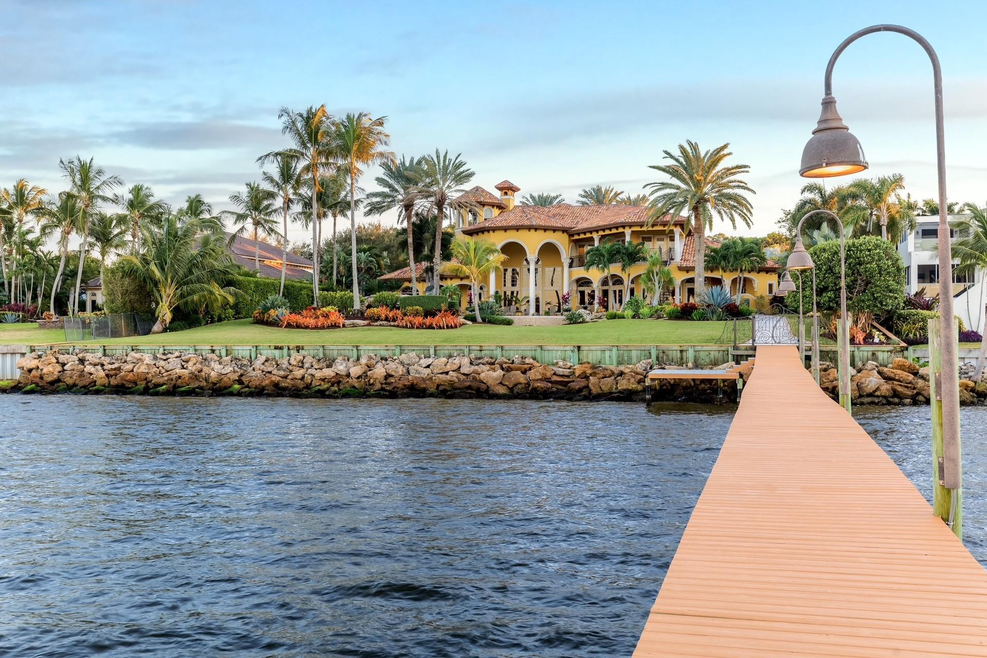 Motivated To Sell!... Experience unmatched luxury in this custom-built waterfront estate in Stuart, FL. Set on over an acre, this 13,000 sq. ft. masterpiece includes 5 bedrooms, 7 bathrooms, a 5-car garage, and exquisite custom woodworking. The main-floor primary suite features light onyx counters, dual closets, and spa-like en suite with pool and water views. Enjoy an oversized pool, grotto, waterfall, chef’s outdoor kitchen, and private dock with 40K, 20K, and 12K lb lifts. A circular drive, grand fountain, covered portico, private elevator, and third-floor tower with panoramic views complete this rare gem.  Floor Plan & Virtual 3D Tour Available upon request.  Easy to Show. Minimal Notice Required.