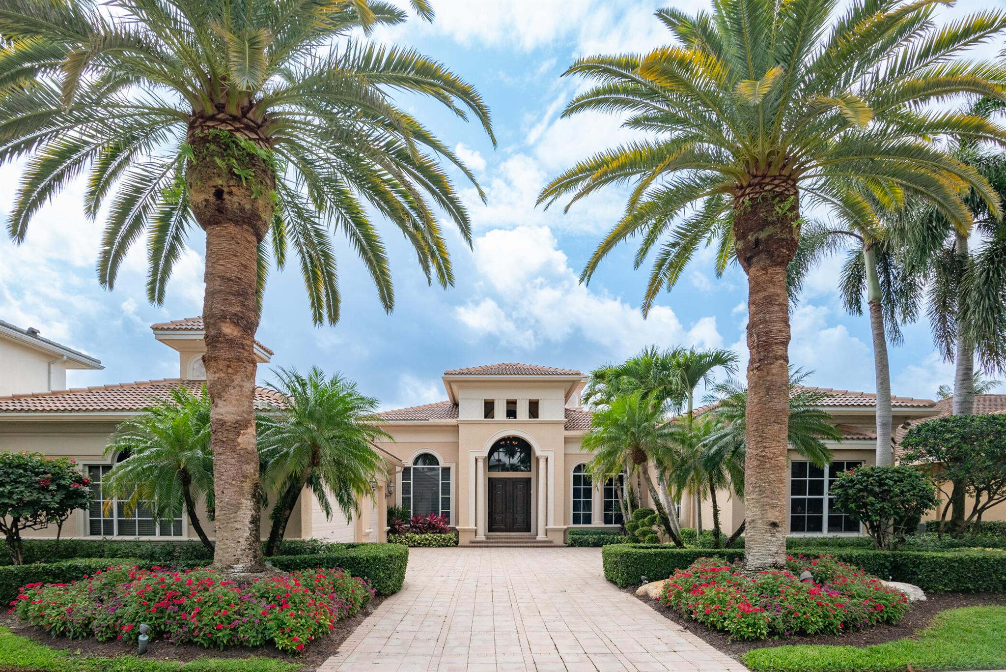 Welcome to this stunning estate home offering almost 4,500 sq. feet of refined living space, perfectly situated in one of the area's most sought-after golf course communities. Located within Ballenisles Country Club, this exquisite residence includes a coveted social membership, granting access to premier amenities including fine dining, fitness facilities, and a vibrant calendar of social events. Golf and racquet memberships may also be available. 
Designed for comfort & sophistication, this home has been thoughtfully updated with a brand new roof from Campany Roofing and 2 new AC units, ensuring peace of mind and year-round comfort.
Ideal for hosting guests or accommodating live-in staff, the property features a  guest suite with its own entrance, offering privacy and flexibility.
