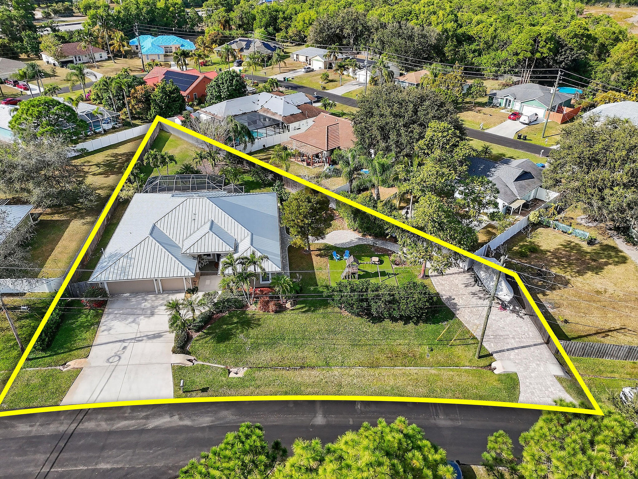 Coming soon to market this Southbend home in central Port St Lucie has unique upgrades you won't find elsewhere. The CBS home is a split floor plan with three bedrooms, an office, and a front room den. The spacious kitchen looks out to the screened pool in back. The yard is fenced and the lot is almost half an acre.  Pertinent upgrades include a roof replacement in 2021 with 24-gauge metal. AC replacement in 2021. Second paver driveway addition with dedicated 50amp electrical and second water meter good for storing a boat and RV or additional vehicles. There is a play pad built with safety foam and synthetic turf located on the side yard surrounded by a garden and additional paver pathways.  Southbend is a great location in Port St Lucie. Ride your bike down to the community park and enjoy the new playground or stroll around the pine-tree lined sidewalks. At the entrance of Southbend is the C-24 Canal boat ramp park where you can launch your boat. Travel south to Becker Road and the Veranda Falls Shopping plaza has a Publix grocery store and a host of other shops and services. Simple access to the FL Turnpike for the commuters makes this location ideal. Visiting Martin County is also an advantage with the scenic back roads through Palm City.