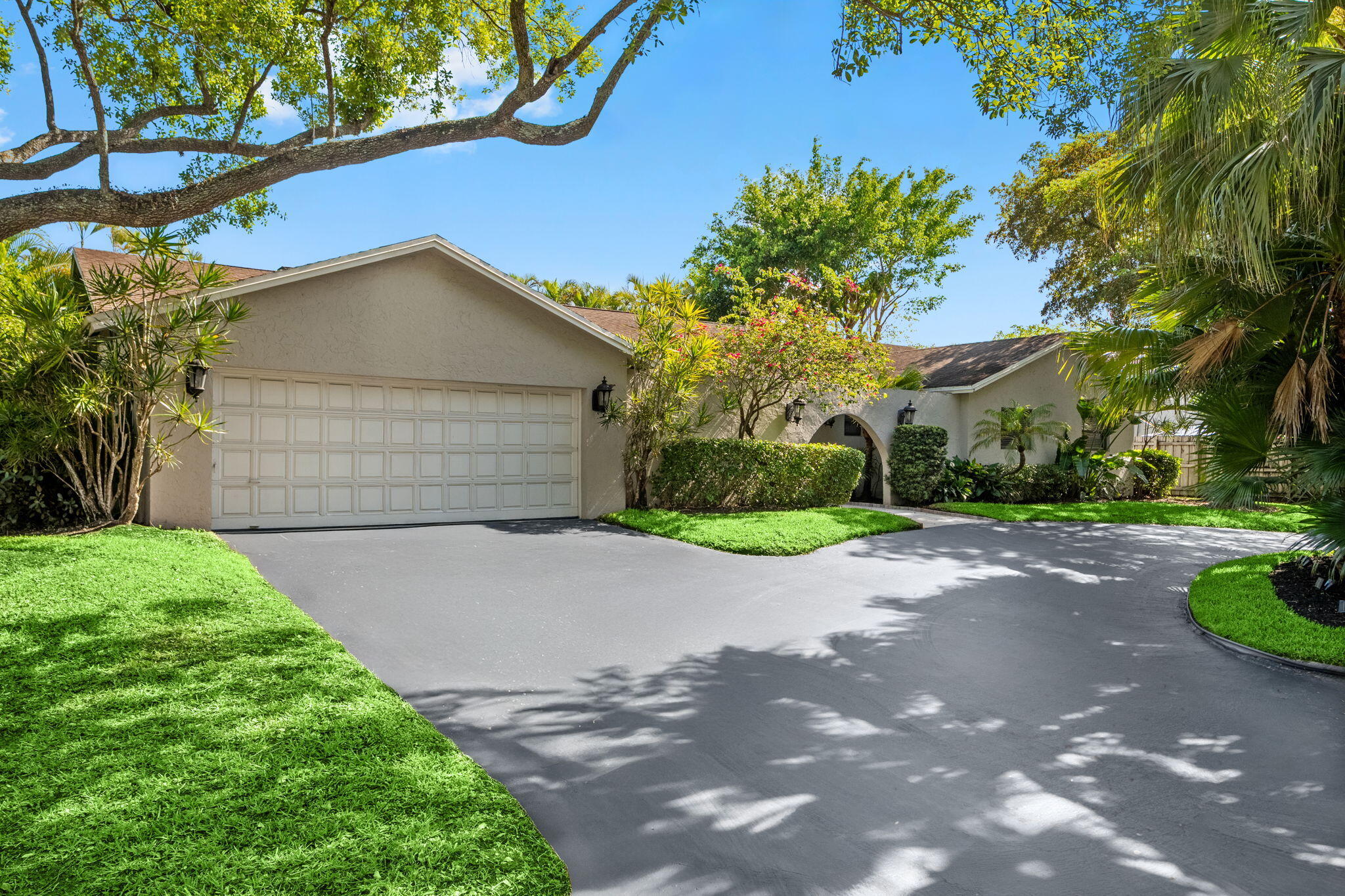 Welcome to 8730 Lake Dasha Terrace in the highly sought after Jacaranda Country Club. This spacious 3Bed/3 Bath pool home sits on a prime corner lot with a circular driveway, 2 car garage and fully fenced yard for added privacy. Inside, the home features a bright and open layout with formal living and dining, a flexible den ideal for home office and cozy fireplace. Floor-to-Ceiling glass sliders flood the space with natural light and lead seamlessly to the private pool area, creating the perfect indoor-outdoor lifestyle. The kitchen includes a convenient service window to the pool, ideal for entertaining. Additional highlights include wood and tile flooring, dedicated laundry room and generously sized bedrooms with large walk-in closets.  Comfort, Space and Privacy in a Prime Location!