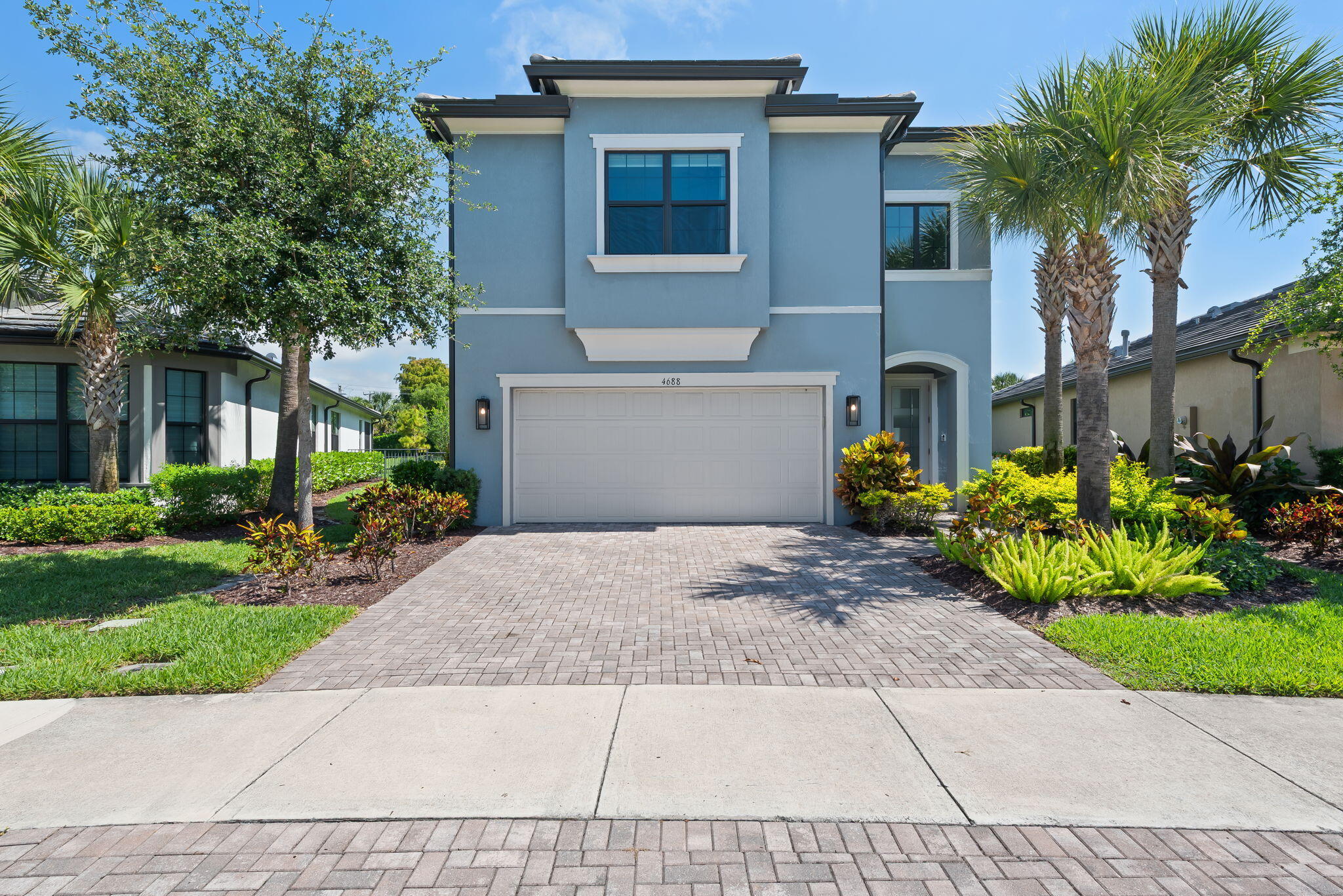 Discover this stunning 3BR/2.5BA pool home in the sought-after gated community of Oak Tree. Built in 2021 on a premium oversized lot, this upgraded residence features one of the community's most impressive outdoor spaces — a rare find in Oak Tree. Enjoy a luxury saltwater pool, spa/Jacuzzi, cascading waterfall, fire features, screened patio, and lush tropical landscaping designed for resort-style living. Inside offers an open-concept layout with abundant natural light, smart home features, upscale luxury chandeliers, first-floor flex room with French doors, upstairs loft, and walk-in closets in every bedroom. Finished 2-car garage, built-in storage, water filtration system, and fenced yard. Resort-style amenities include clubhouse, fitness center, pool, pickleball courts, and barefoot bar.