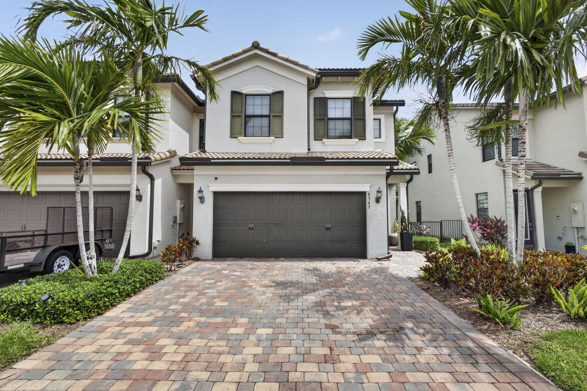 Beautiful 3bed/2.5 bath townhome with 2-car garage located in the highly desirable Fields community in West Lake Worth. Built in 2019 with solid concrete construction and impact windows throughout, this fully upgraded home features an open-concept floor plan, oversized granite kitchen island, upgraded tile flooring, and designer fixtures and finishes throughout. Enjoy a private driveway, spacious living areas, and modern hurricane protection for peace of mind. Conveniently located near the Florida Turnpike, SR-7, Wellington shopping and dining, and top-rated A-rated schools. The Fields offers resort-style amenities including a clubhouse, fitness center, pool, playground, and scenic walking paths.