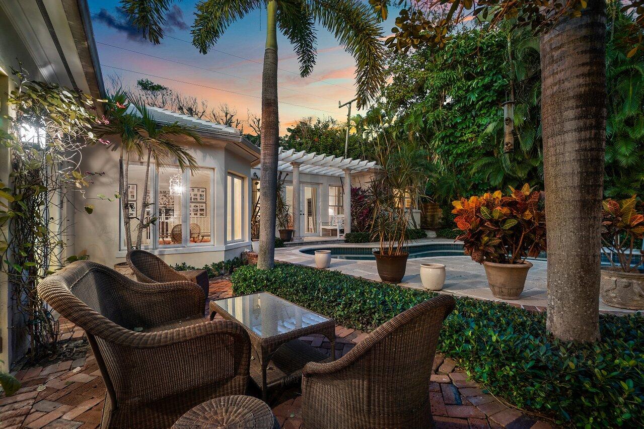 High on a Palm Beach hilltop, this comfortable family home is move-in ready or a blank slate for   a buyer's update plans. 
Elevation is over 20', making FEMA guidelines a non-problem for any contemplated renovation.
This one-story home has 3 bedrooms, each with en-suite bath, and a light and bright living room and loggia that face on to the pool and surrounding terraces.
The master suite is especially inviting with an adjacent study and morning room plus a large walk-in closet and bath.  
The lot is 11,326 sqft perched on high ground at the corner of quiet Jamaica Lane, convenient to the nearby pedestrian Lake Trail and just 7 minutes by car to the shops and restaurants of Royal Poinciana Plaza.