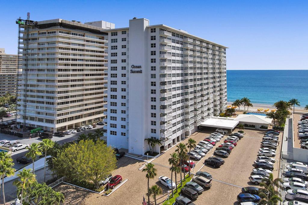 Priced to sell! Wake up to spectacular, unobstructed ocean views from this spacious 2-bedroom beachfront condo. Filled with natural light, the residence features impact windows and doors throughout, tile flooring, an in-unit washer and dryer and a generous private balcony perfect for enjoying the coastal breeze and stunning sunrises. A rare and highly sought-after deeded garage parking space is included with the purchase. Ocean Summit continues to enhance its appeal with a beautifully renovated lobby currently underway and recently completed hallway renovations, sprinkler system & new roof. Residents enjoy an impressive array of amenities including 24-hour security, key-fob controlled entry, a fitness center, boardroom, library, bike storage, and a private storage