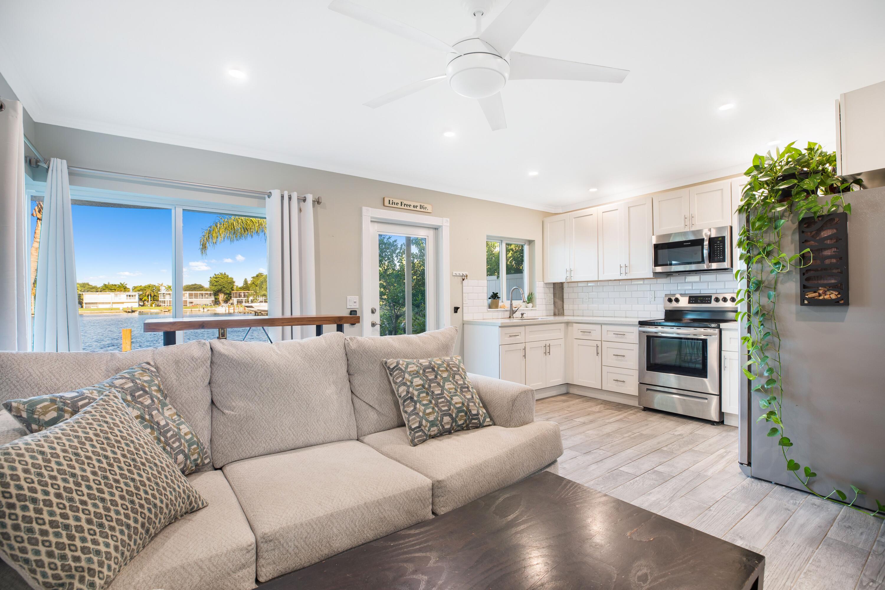 Imagine waking up, grabbing your morning coffee, and walking out onto your private, ground-floor deck to watch the sunrise over the water. The wide canal stretches out before you, perfectly still in the early light. You pack the cooler, step across the garden, and head straight down to your boat waiting at the on-site dock. There are no elevators, no crowded marinas, and no hauling gear across a massive parking lot—just seamless, effortless ocean access right from your back door. Tucked away on a quiet, peaceful residential street in East Pompano, enjoy this front-row seat to Atlantic sunrises and glowing moonrises over the water. The unit comes with fresh updates to the kitchen, floors and bathroom.