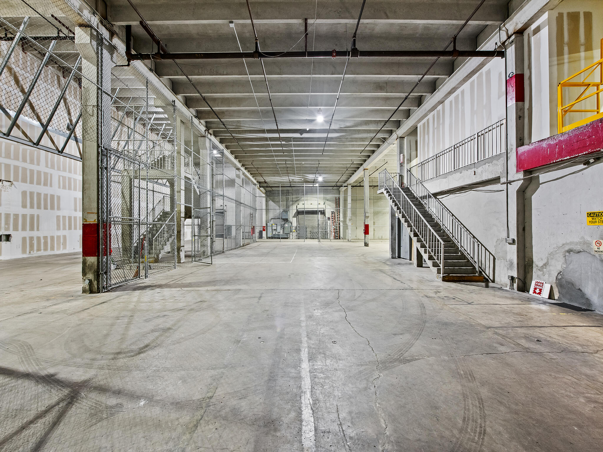 Position your business in one of Fort Lauderdale's most unique industrial and flex environments. Located at 1600 NE 12th Terrace, this expansive warehouse and office opportunity offers a rare combination of high-clearance industrial space, mezzanine offices, loading capabilities, and flexible configurations in the heart of the city's rapidly evolving Studio City and Middle River submarket.  The available premises include approximately 12,125 SF of ground-floor warehouse space, 1,900 SF of first-floor mezzanine office space, and 9,317 SF of second-floor mezzanine space, providing users with the ability to accommodate warehousing, distribution, manufacturing, showroom, production, creative office, or operational headquarters under one roof.